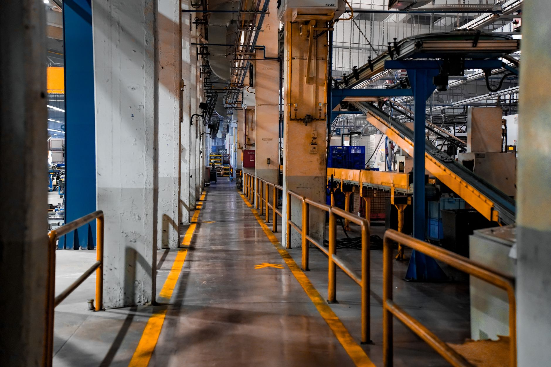 Close-up of an empty, stationary industrial conveyor belt system, illustrating its permanent and fixed infrastructure.