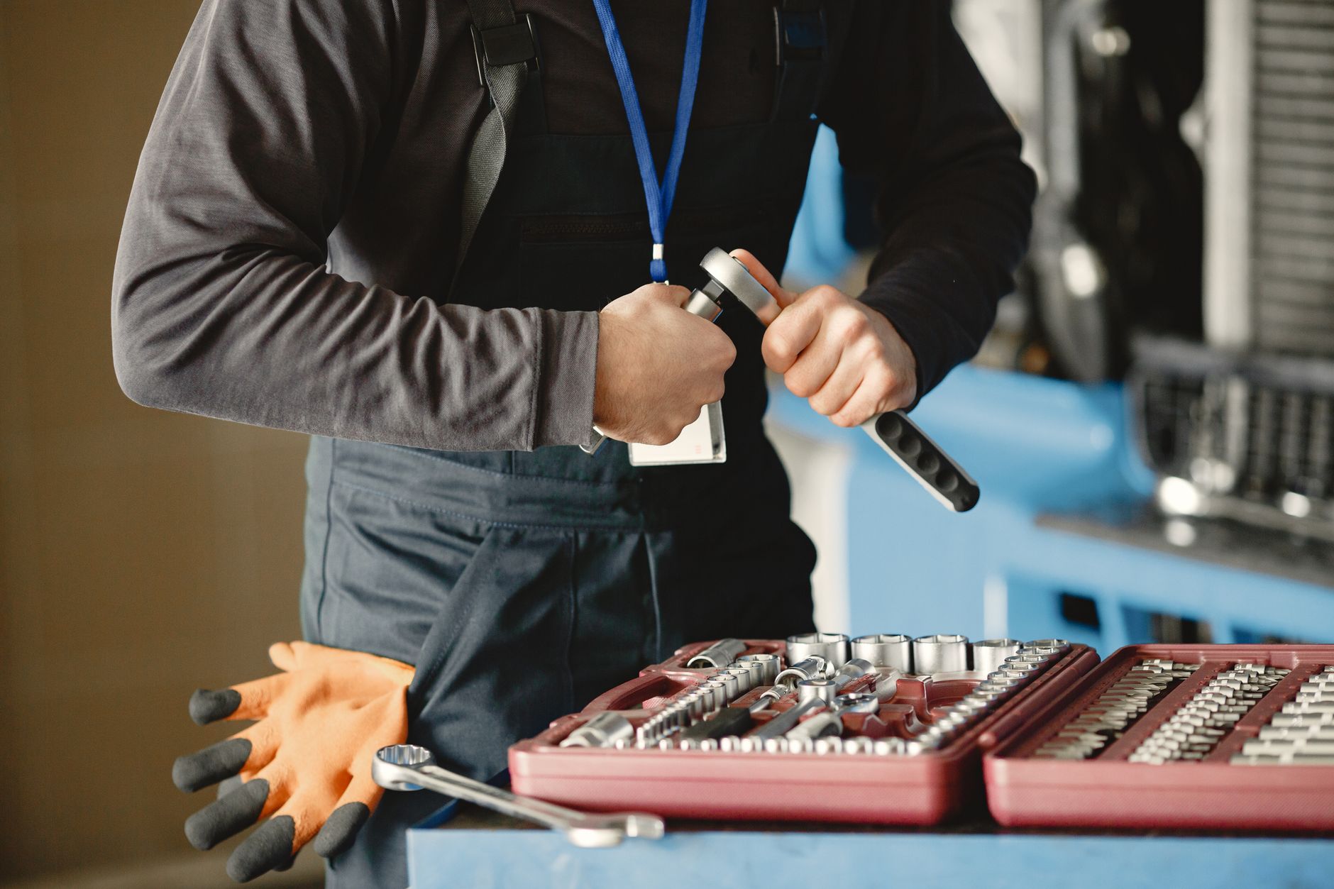 Industrial hand tools at a torque station, analogous to calibrated closure tooling on an automated spindle.
