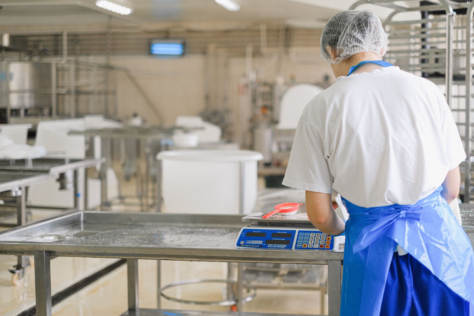 A digital scale with packed boxes, used for gross weight checks after kit fill.