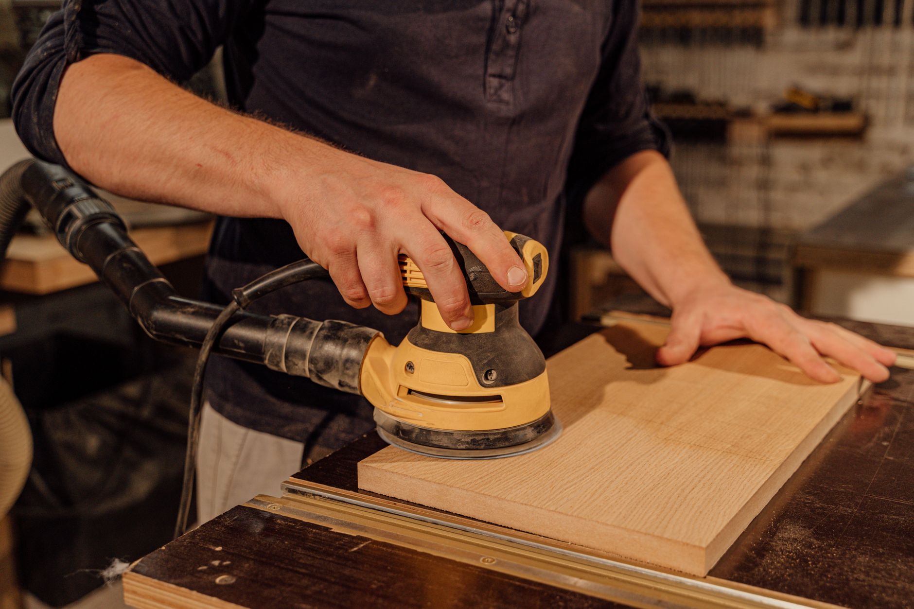 Bench sanding and dust that O&P labs must capture before automating trim and polish passes.