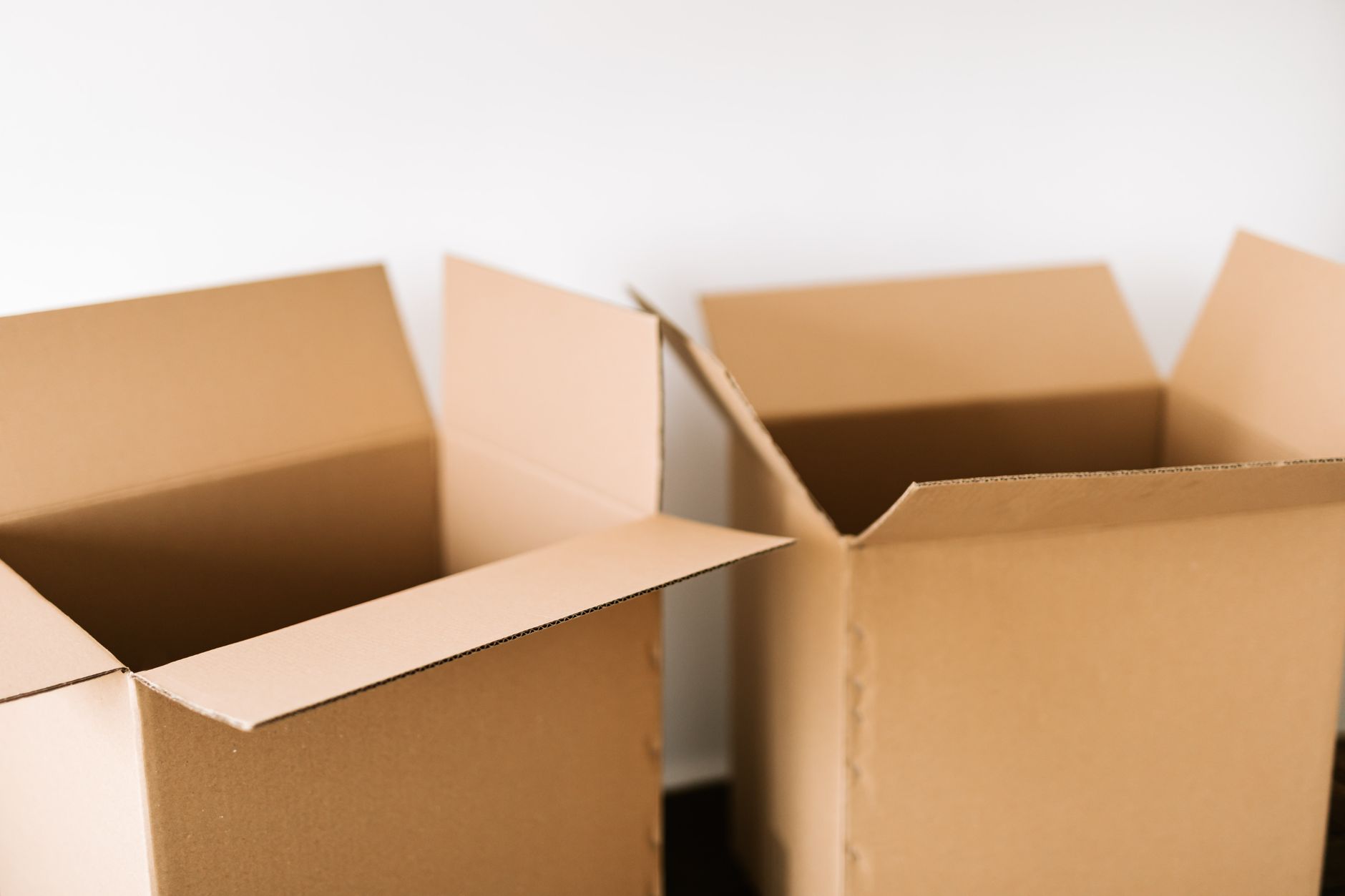 Open cartons and packed boxes on a bench where repeat kits and will-call orders are assembled and verified.