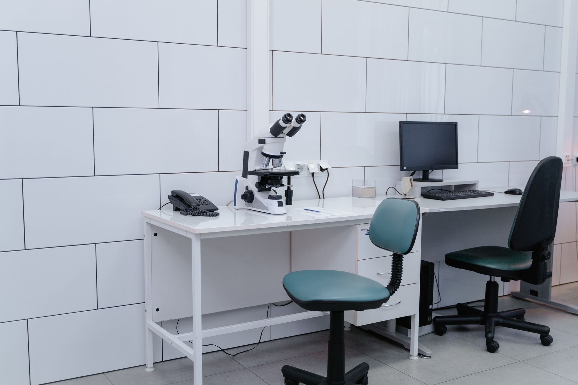 Clean laboratory workspace with gloves and supplies, highlighting the hygiene expectations around bottle handling.