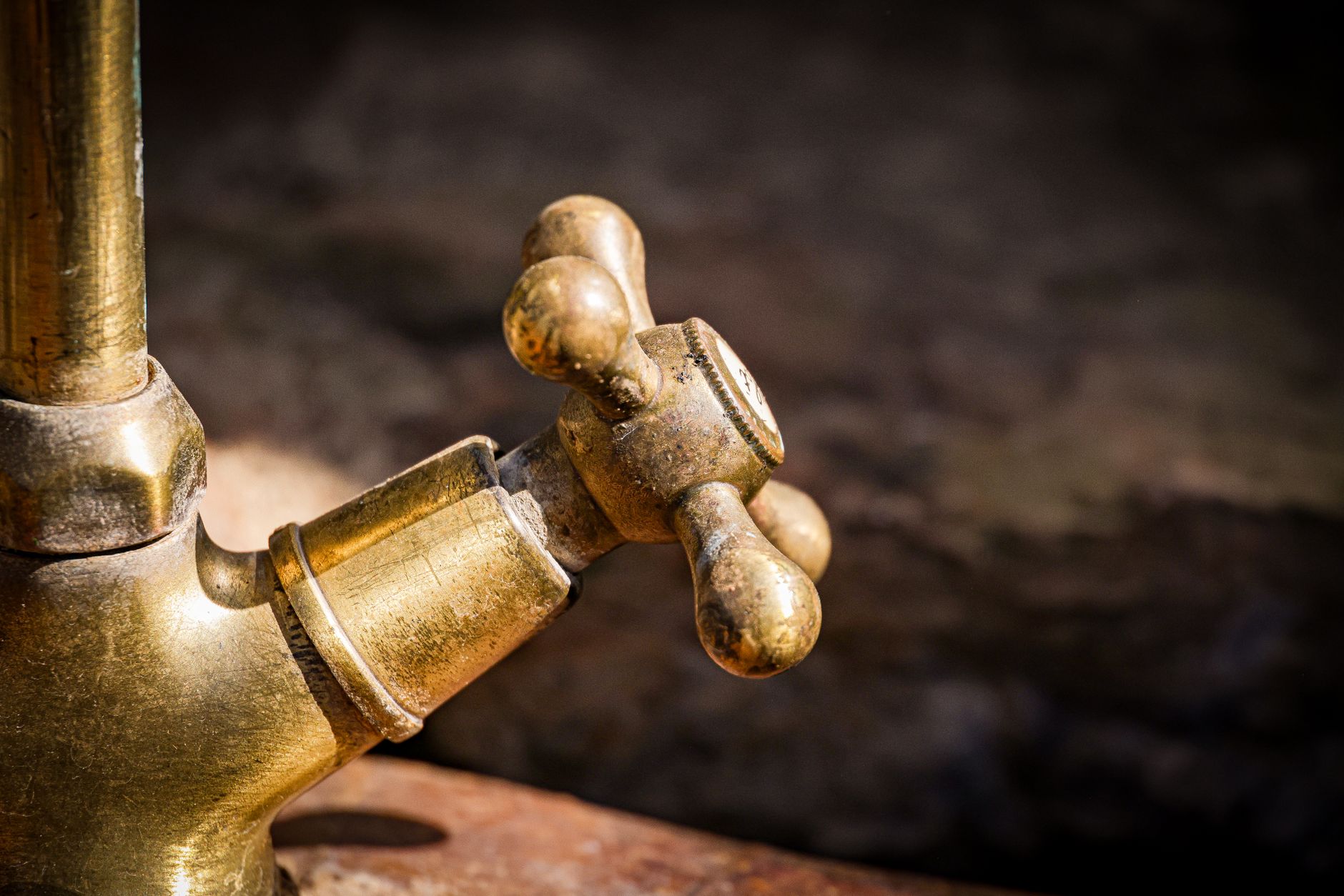 An assortment of faucet bodies, valves, and fittings illustrating the product variation a test cell must accommodate.