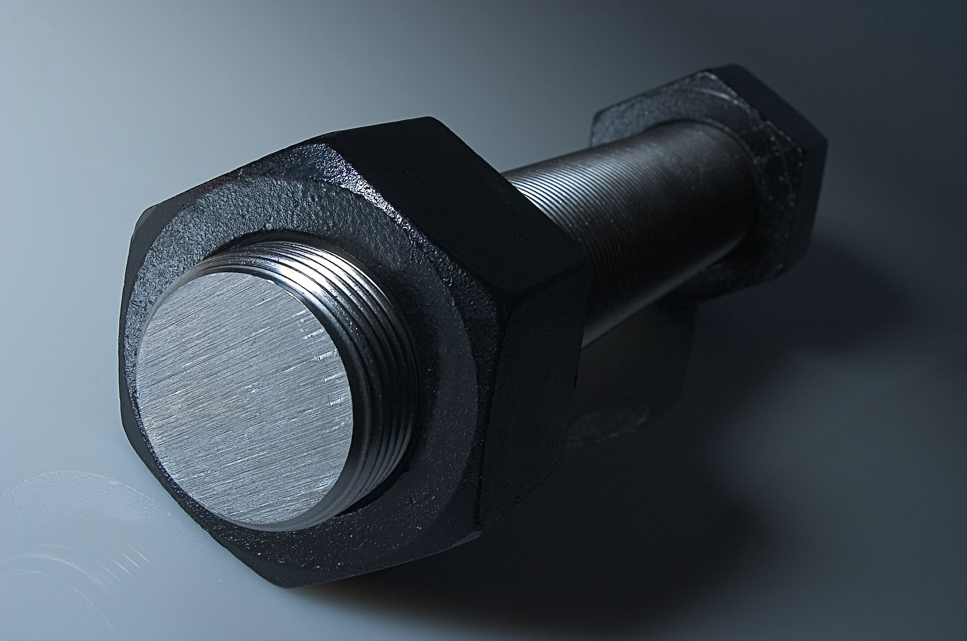 Stacks of machined metal components on a factory floor, the kind of parts that move through industrial wash cells.