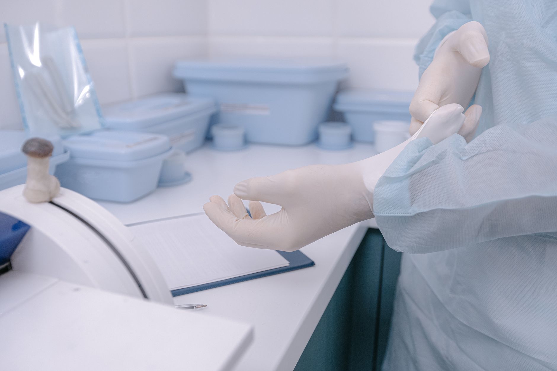 A clean bench with gloves, trays, and wipes shows the controlled transition between messy polishing work and inspection-ready handling.