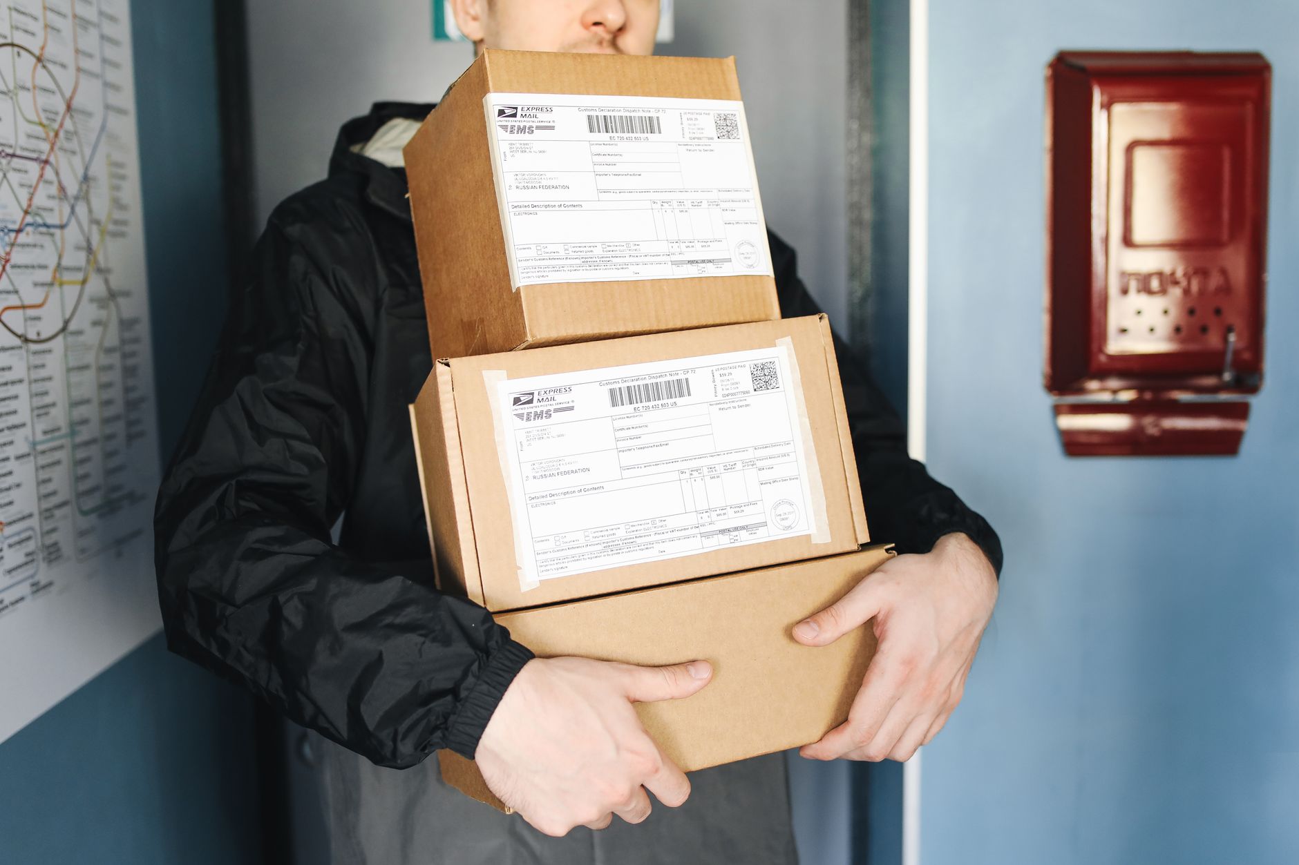 Cartons on a packing table where barcode verification should gate the final seal.