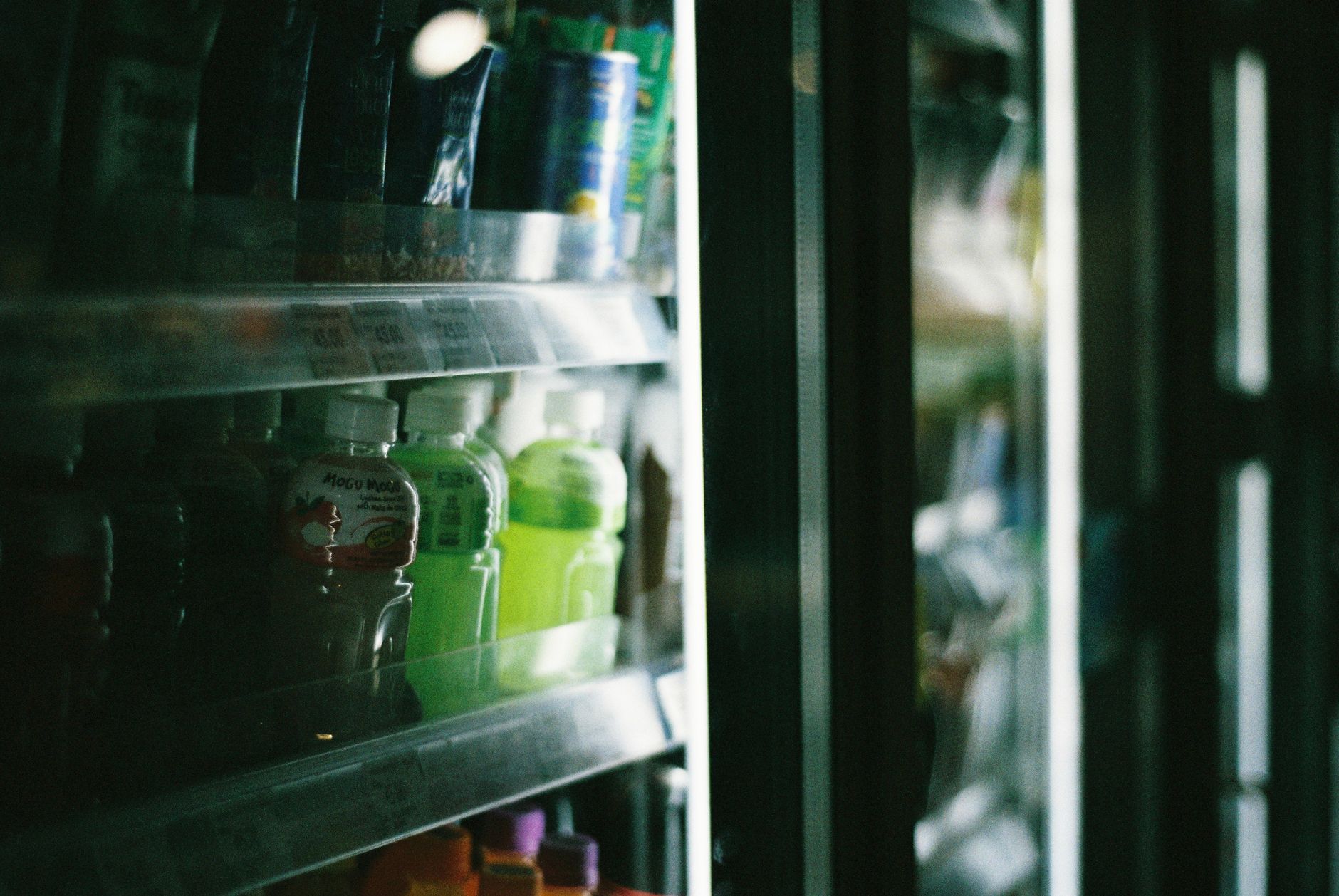A walk-in cooler interior where packed flowers wait under cold-chain rules.