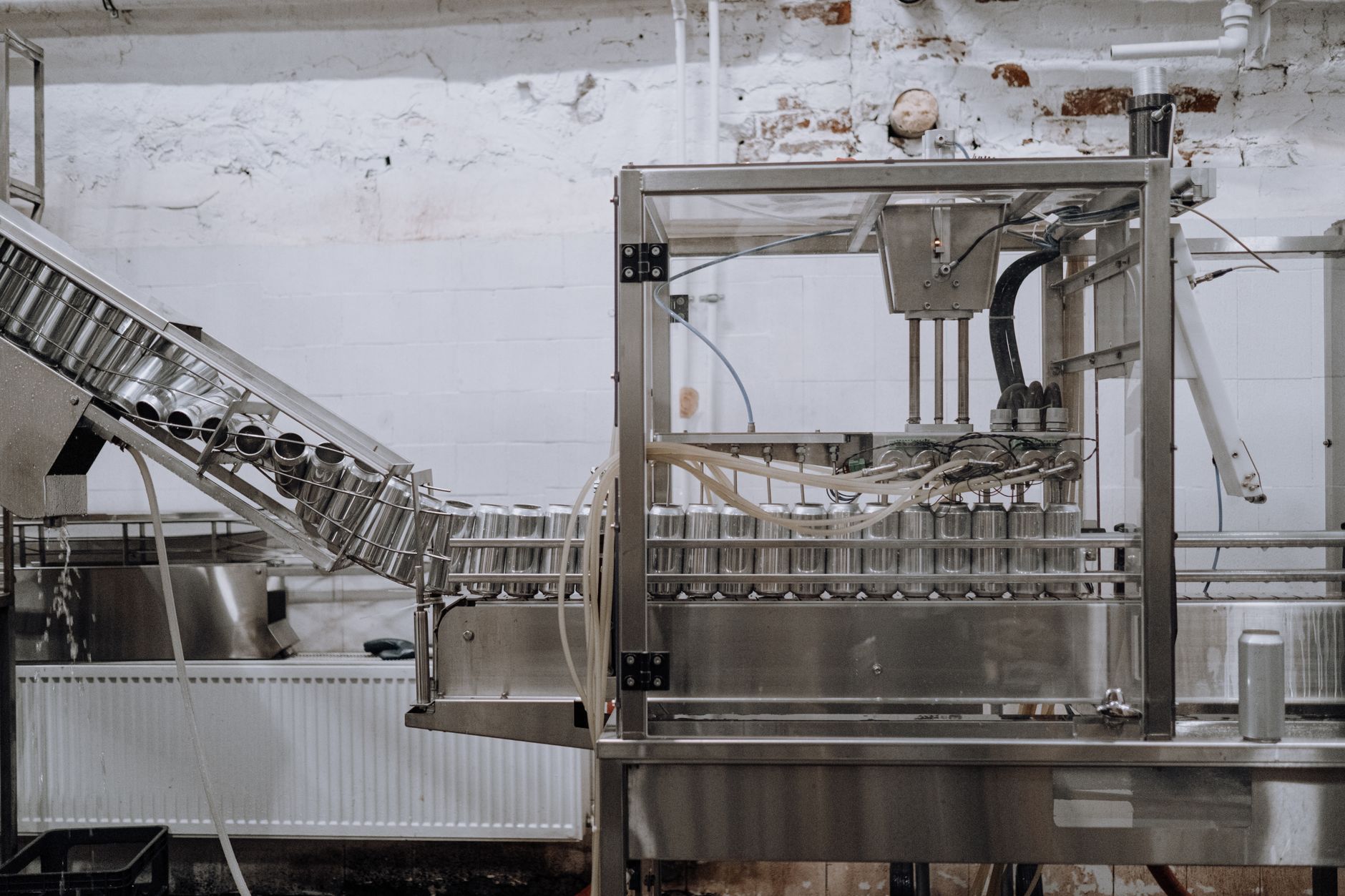 Stainless food-processing surfaces and utensils that must stay sanitary under animal food CGMP rules.