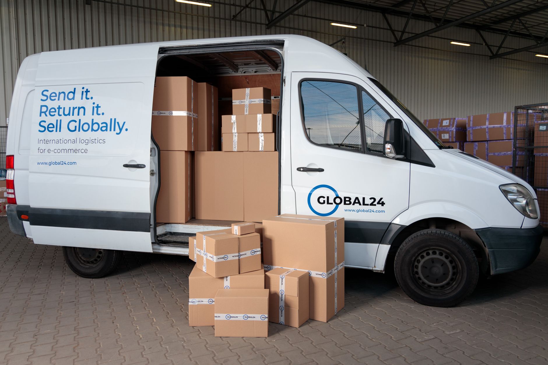 Salvage area with damaged shipping cartons where intact product can move into replacement boxes.