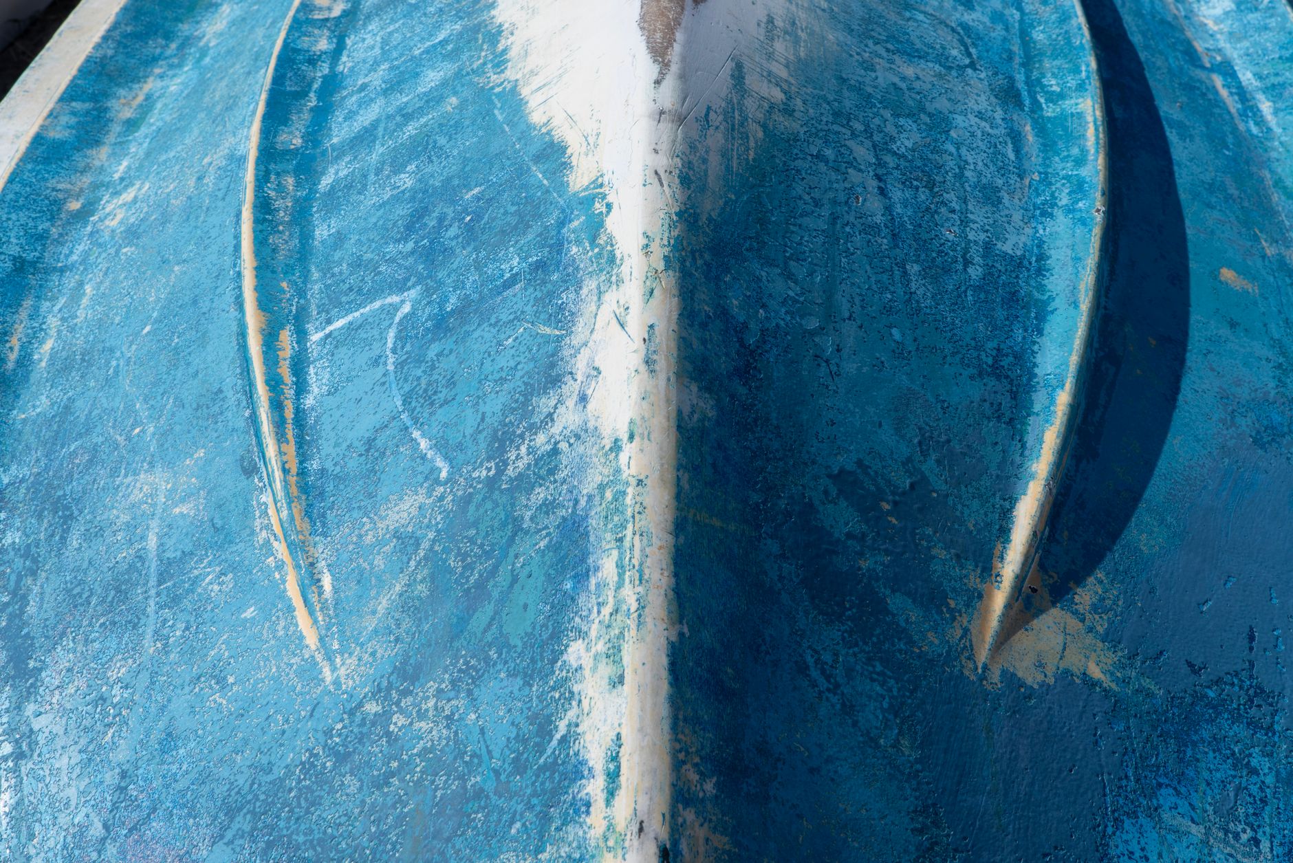 A close view of a fiberglass composite panel surface showing the finish that sanding must preserve.