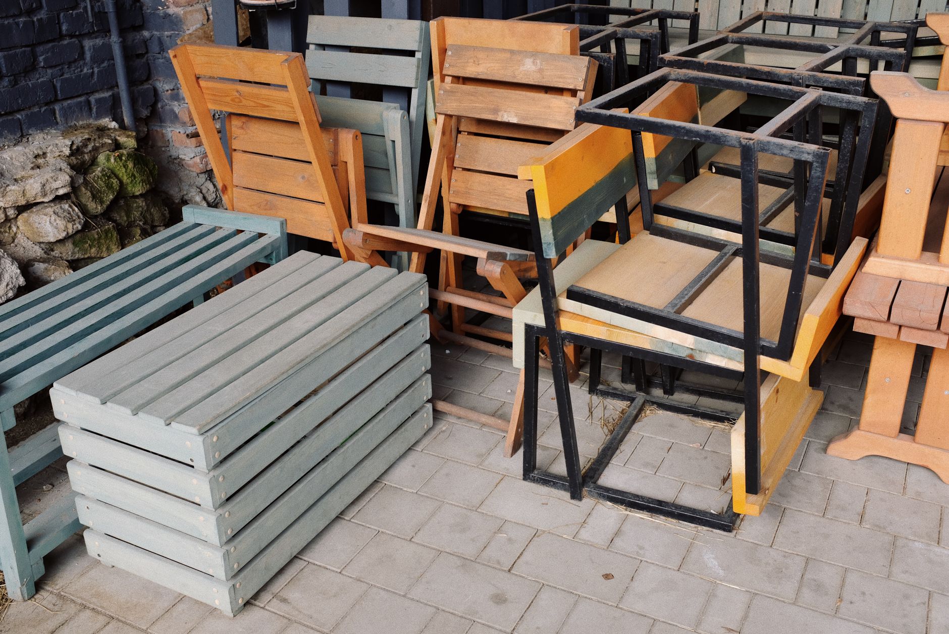 Bare wooden chair frame staged on a worktable ready for upholstery.