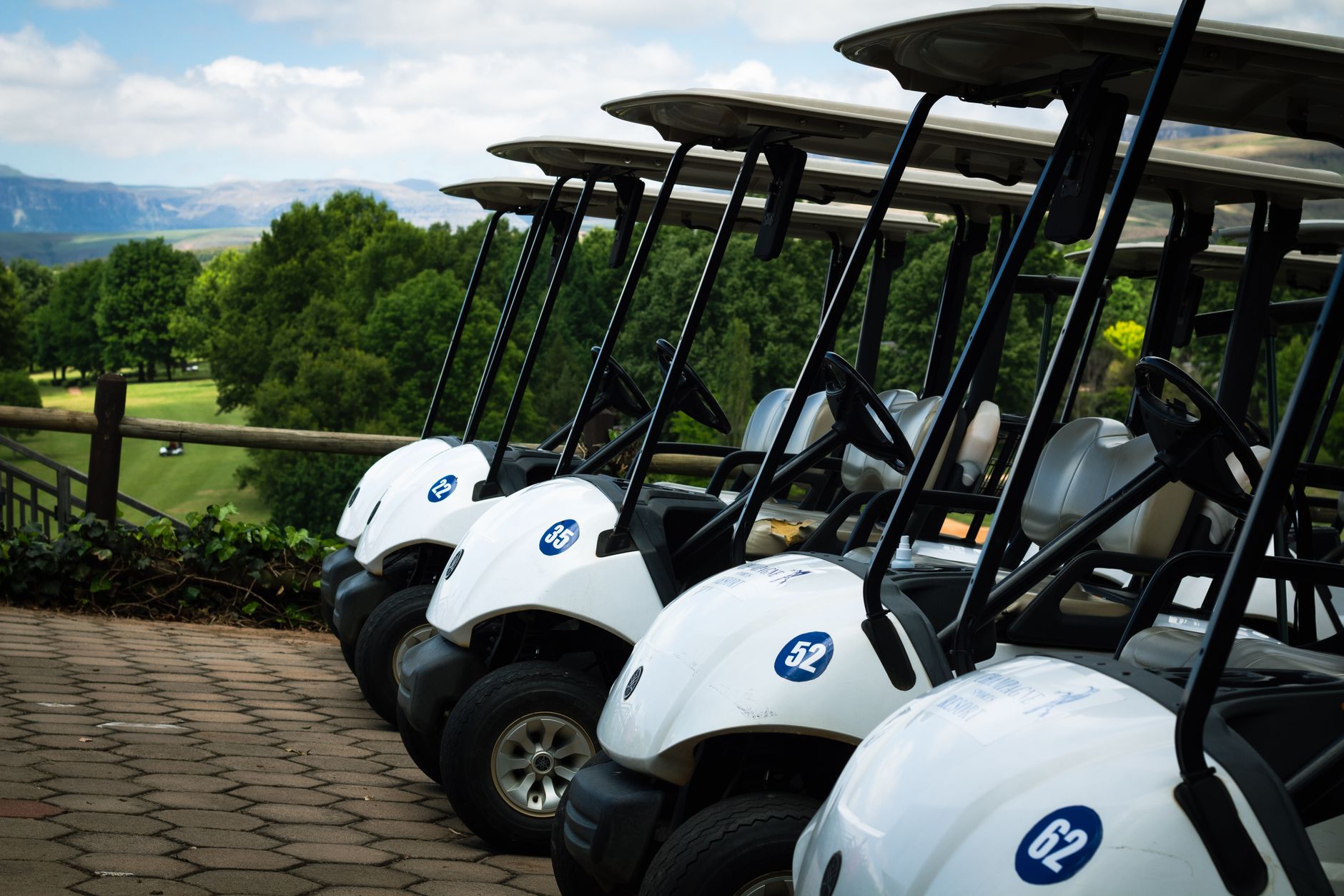 Carts moving across fairways during a crossover turnaround window.