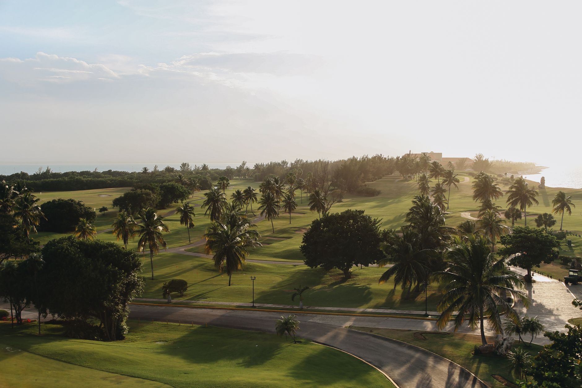 Soft dawn light over a quiet golf course fairway