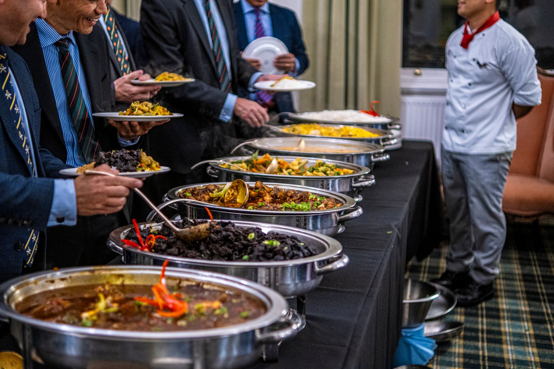Conference floor setup where catered trays arrive separately from document deliveries.