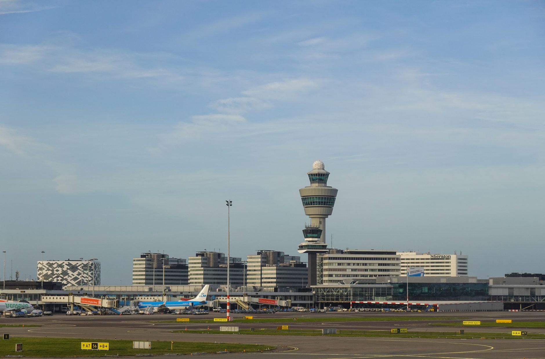 An airport control tower image reinforces that drone blood delivery is constrained by real airspace rules and approvals.