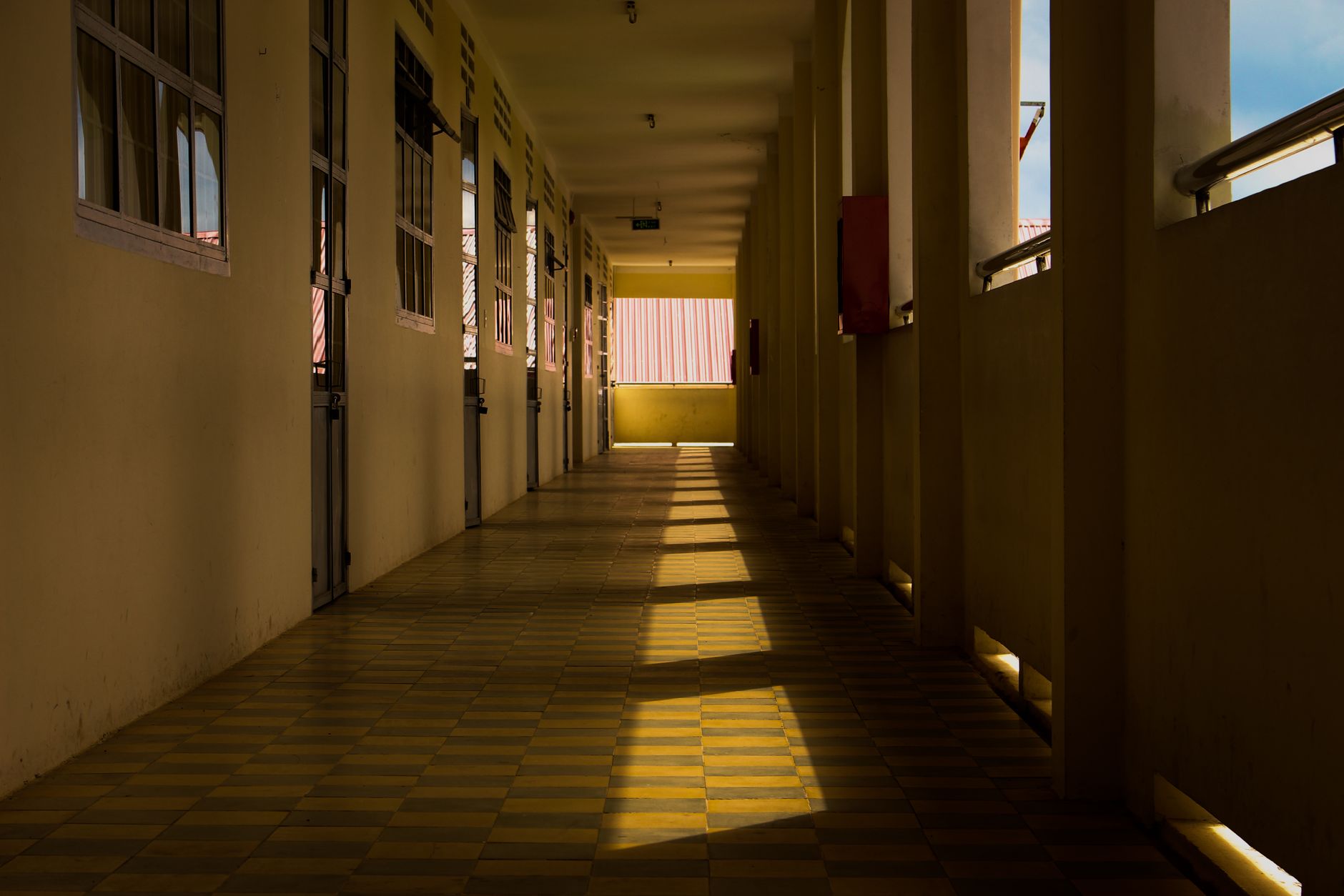 School corridor tile where dust-season scrubbing keeps floors safe before classes start.