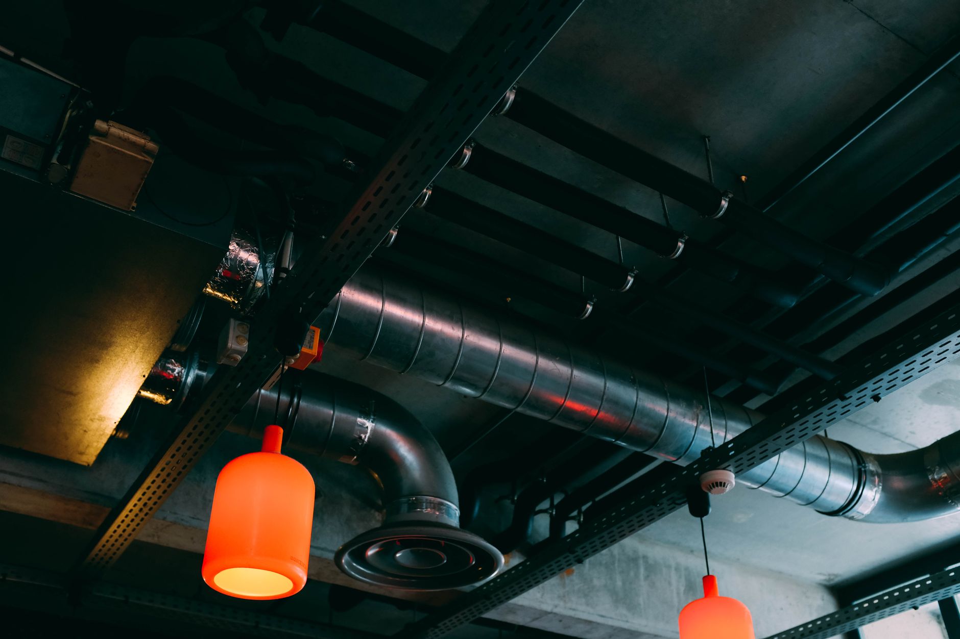 Overhead utilities and ceiling structure that overhead cobot mounts must clear during layout planning.