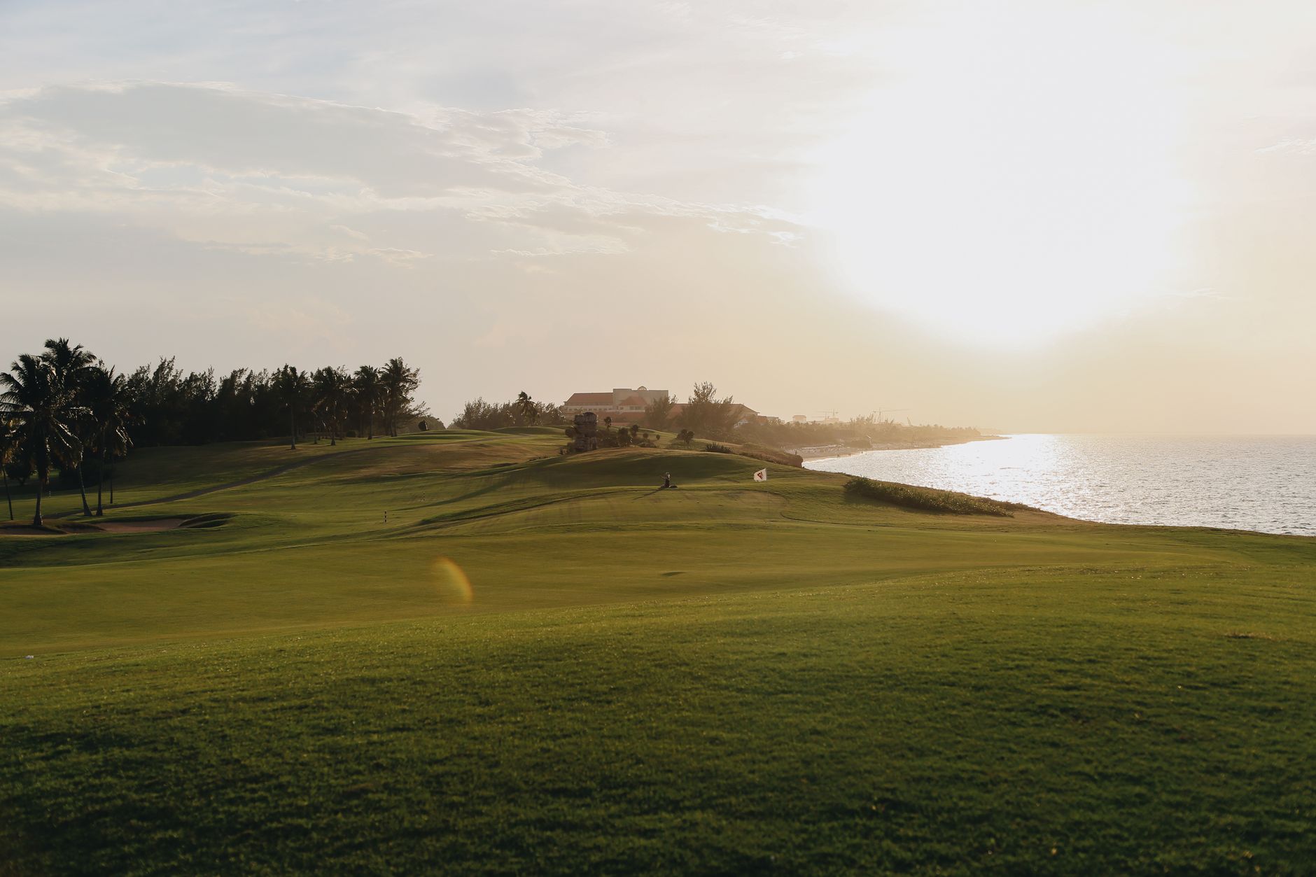 Open fairway under bright sun with little shade