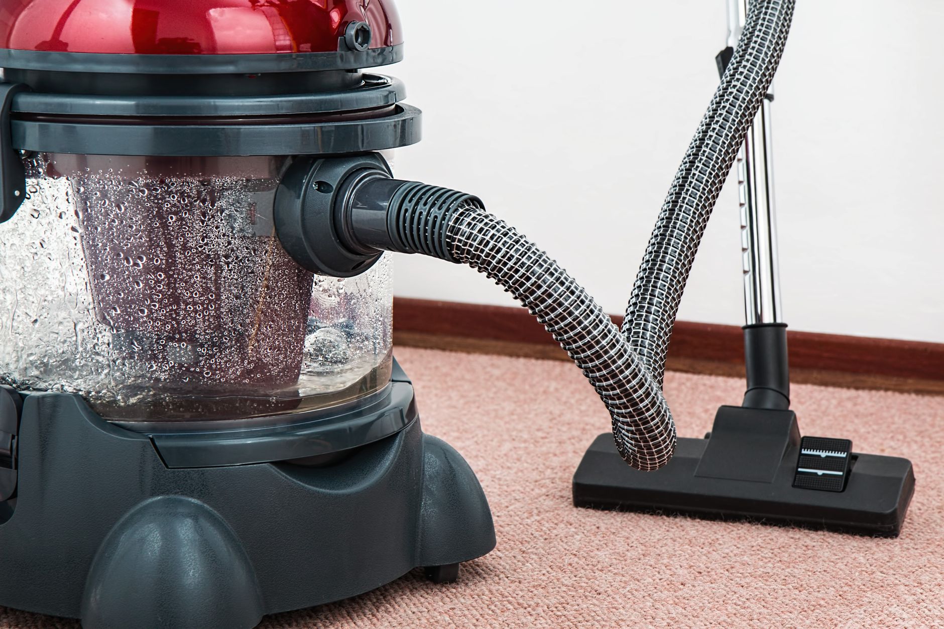 Carpeted office aisle where dry vacuum paths are the main HEPA filtration concern.