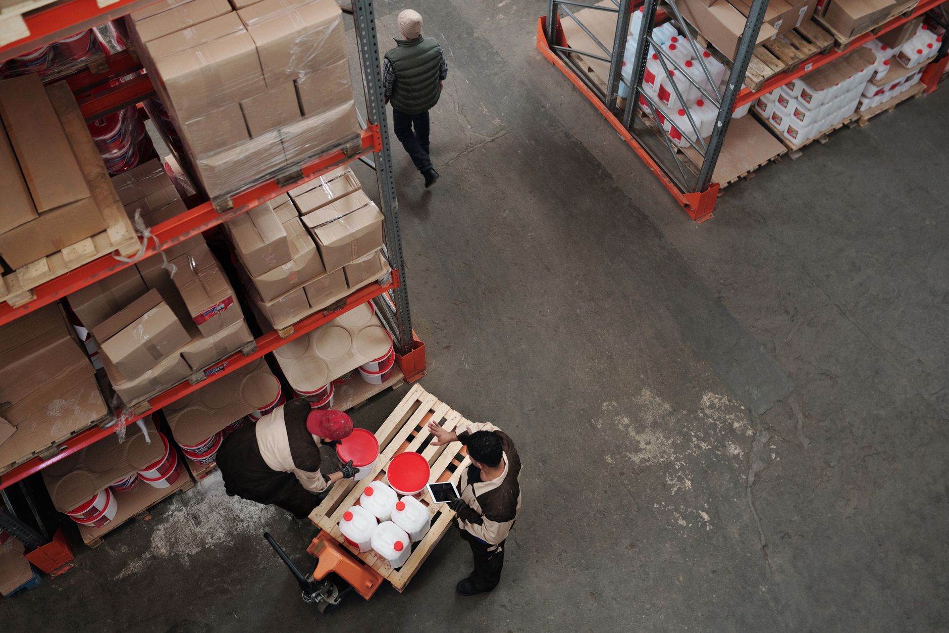 Packaging line area where consumables such as labels and cartons feed production cells.