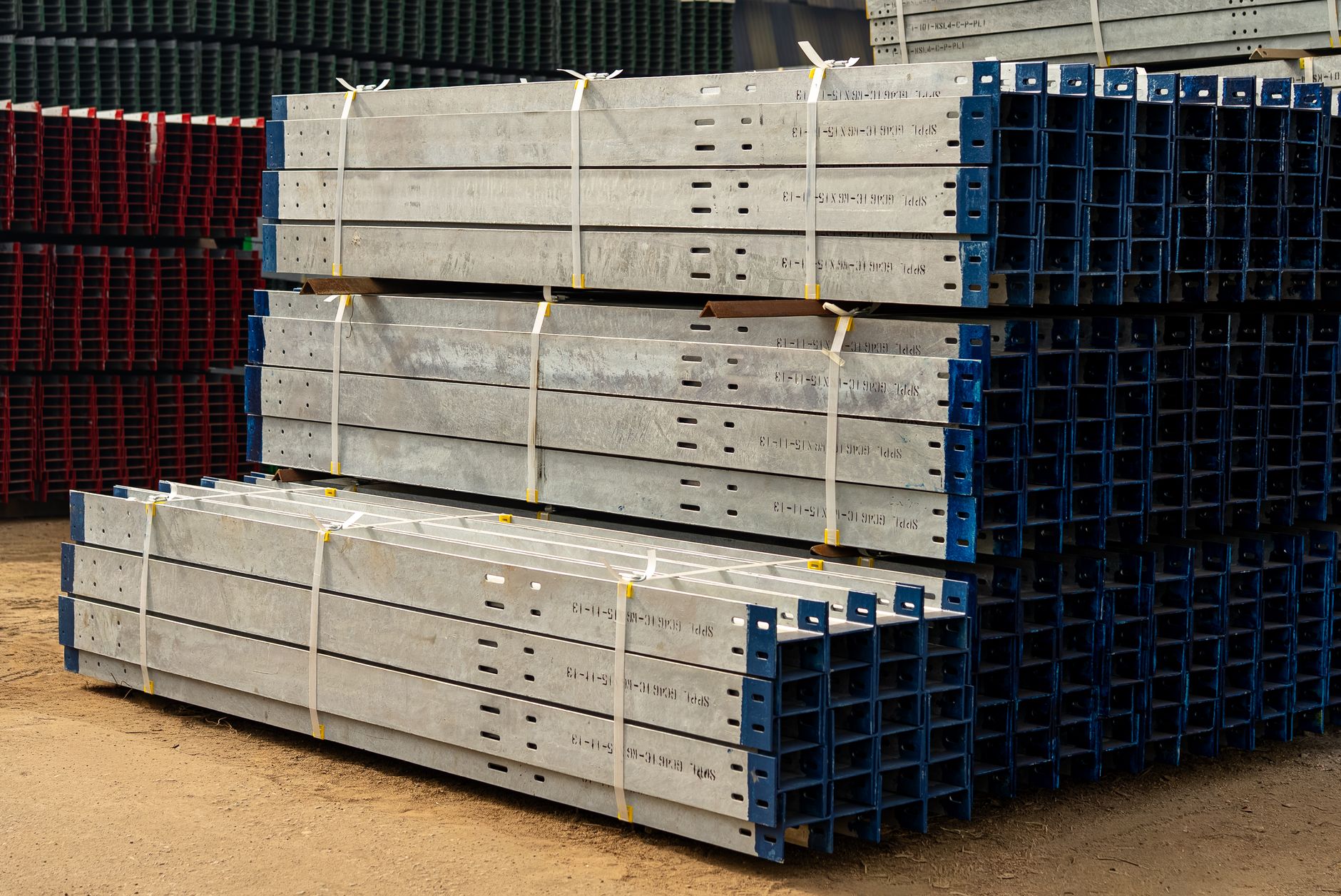 Shelves in a factory holding numerous metal components, representing the work-in-progress (WIP) inventory that lean principles aim to reduce.