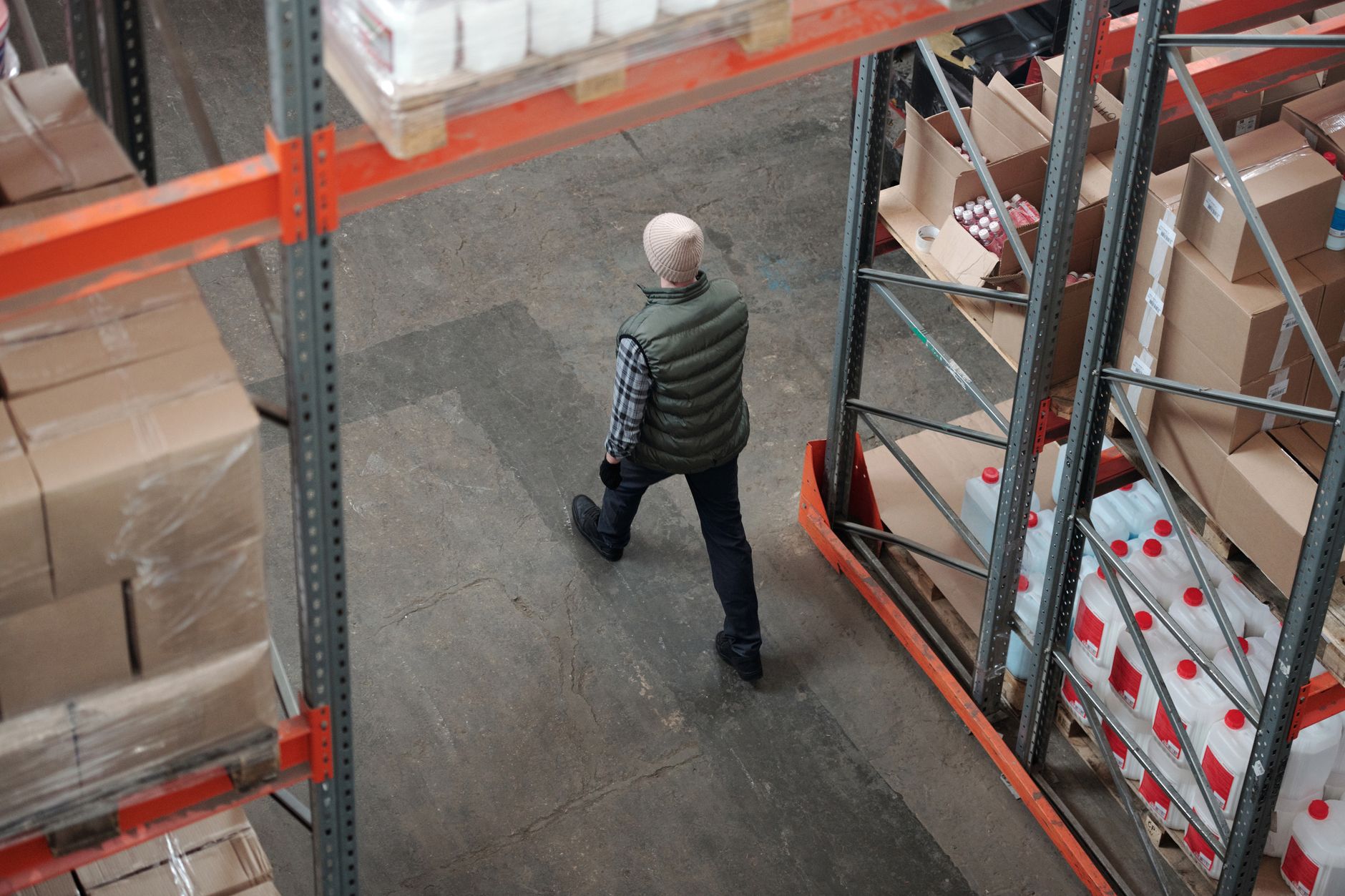 A close-up of an icy or frosty floor in a refrigerated warehouse, illustrating the navigational challenges for AMRs.
