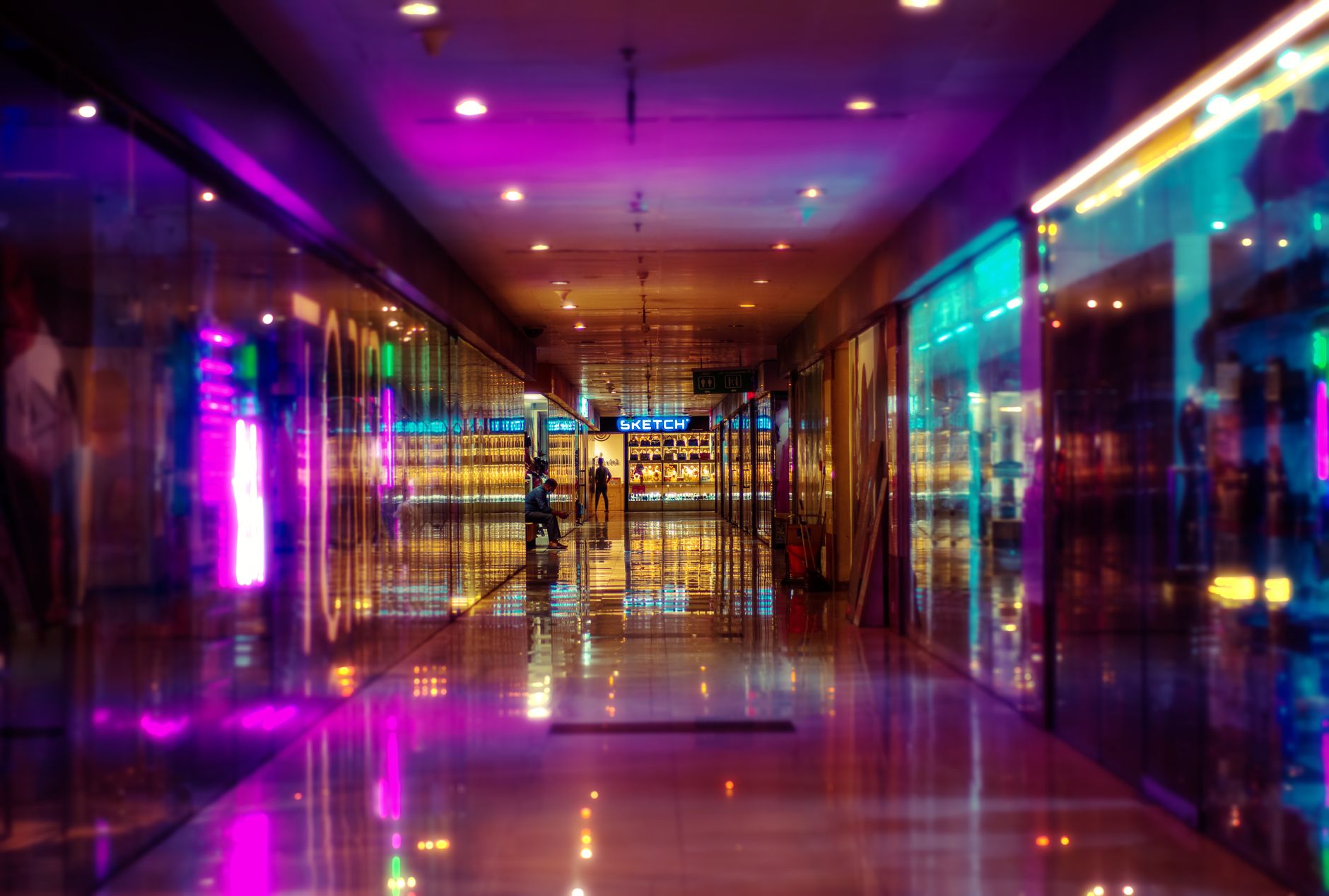 A quiet mall walkway after hours when deep floor scrubbing can run without shopper disruption.