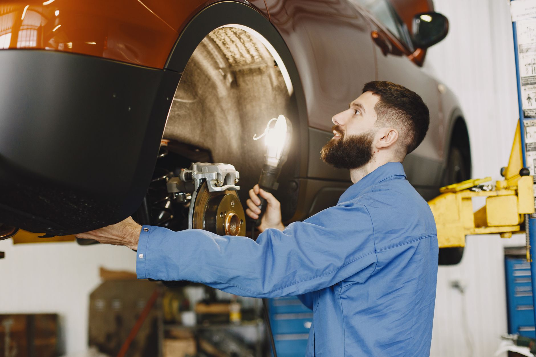 A quality inspector examines finished parts to separate accepted output from scrap and rework.