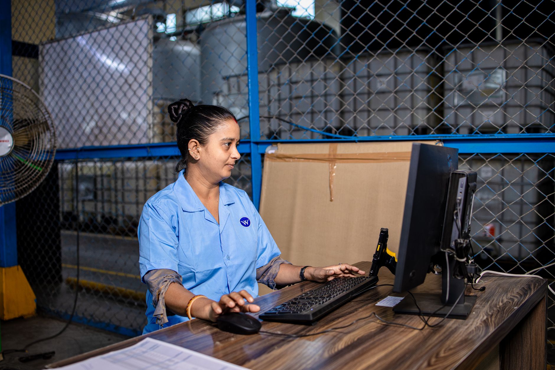 Regional planners at a desk, a stand in for corporate finance standardizing robot usage exports across sites.