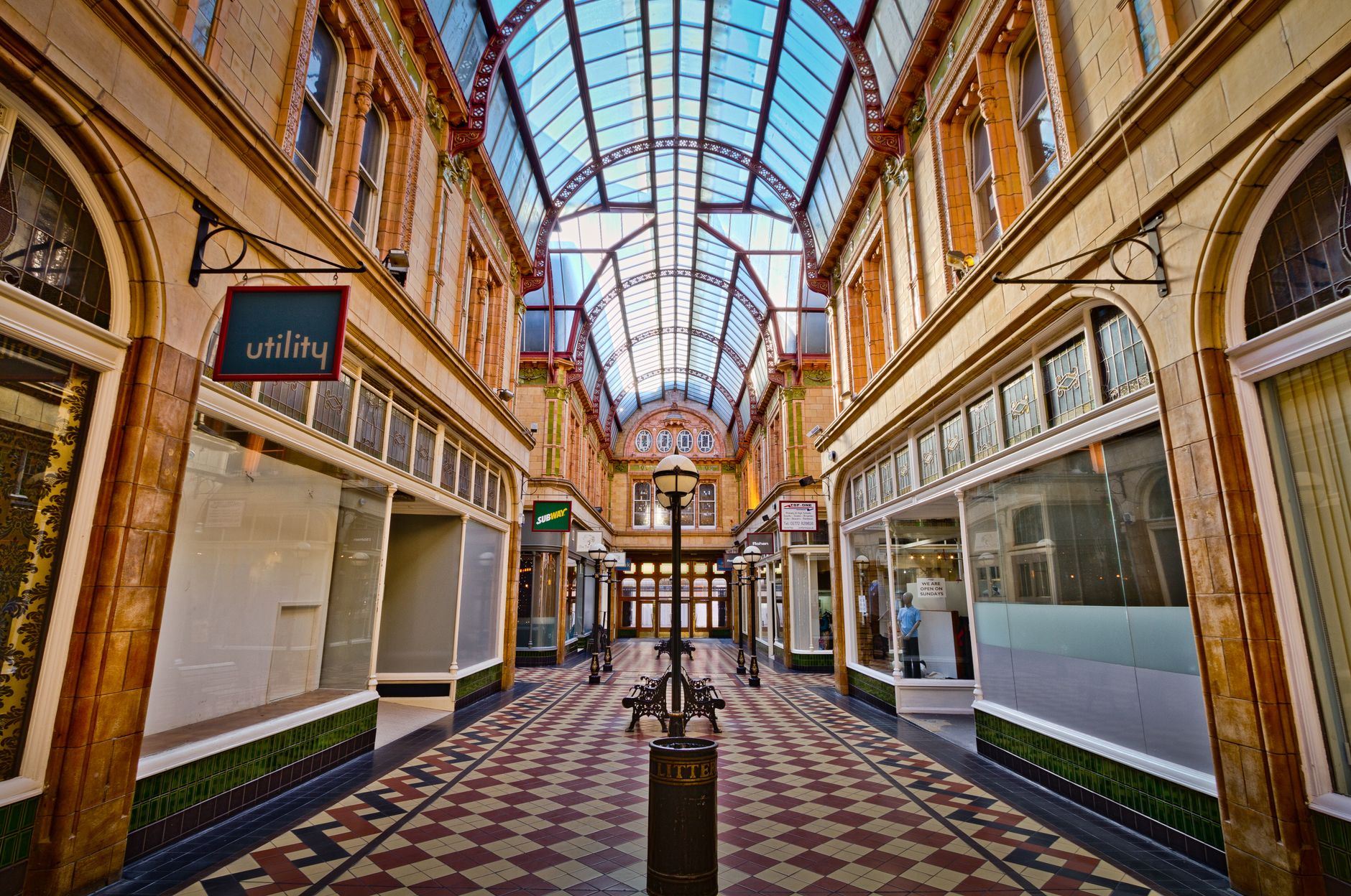 Wide view of a modern enclosed mall concourse, giving regional owners a clear sense of the shared spaces where portfolio robot budgets are usually evaluated.