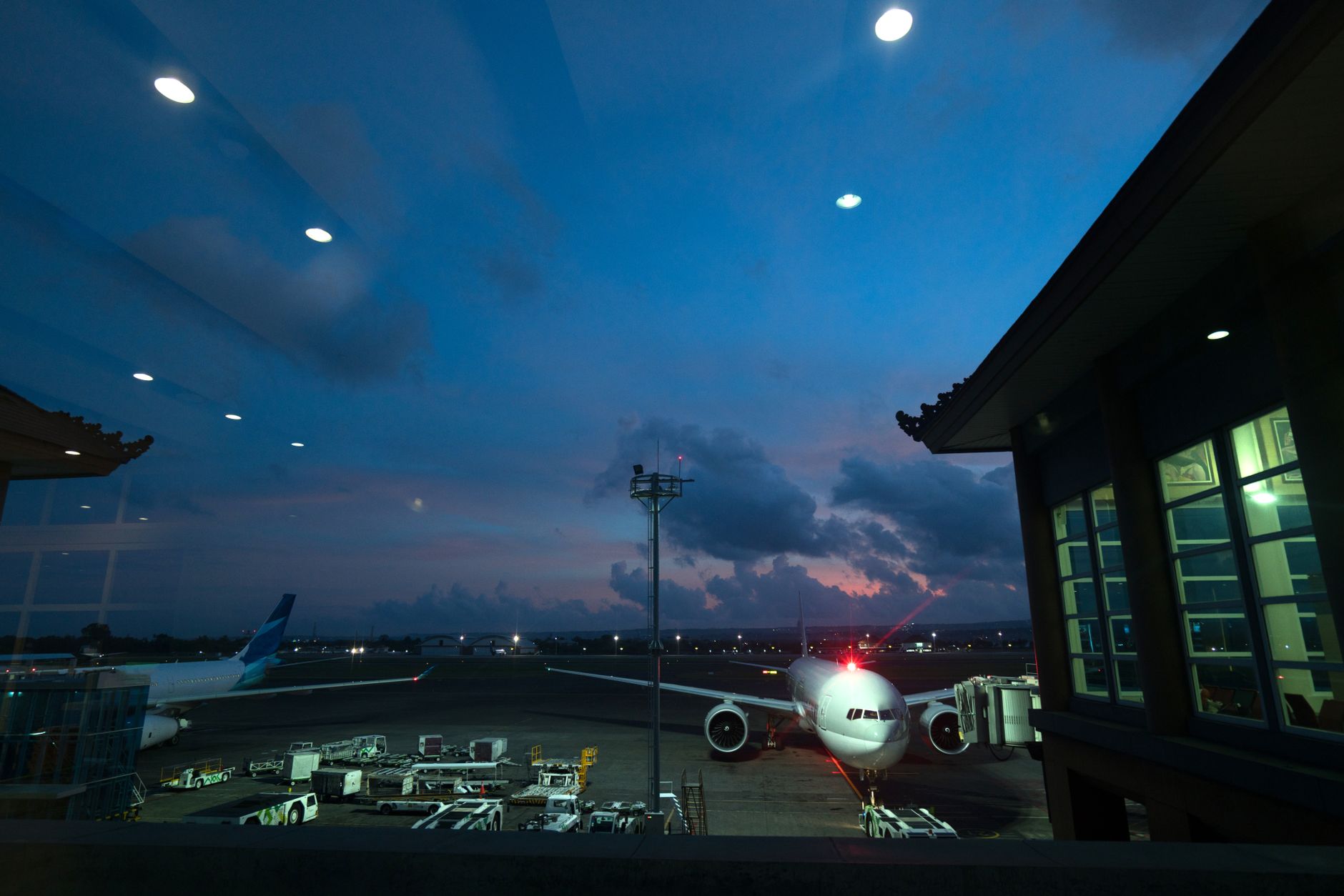 A quiet regional airport terminal at night, the kind of setting where overnight cleaning and inspection routines shape a practical first robot program.