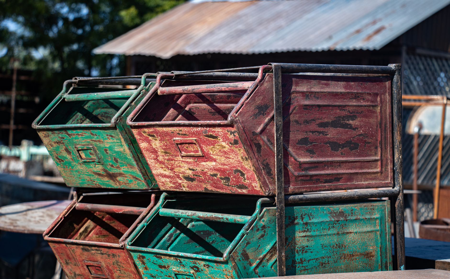 Line-side bins and staged materials beside a production area, showing the kind of repeatable stop pattern that suits a tugger milk run.