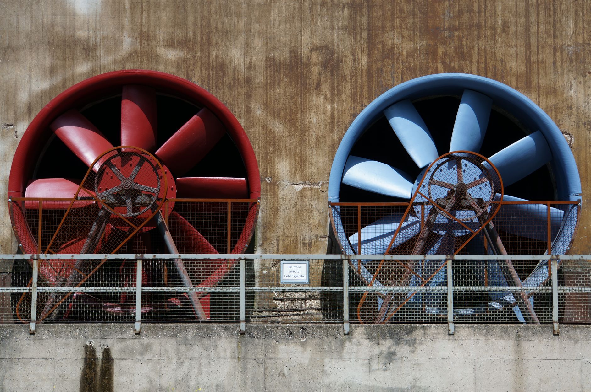 Industrial ventilation equipment mounted inside a warehouse, illustrating the airflow control a battery room depends on.