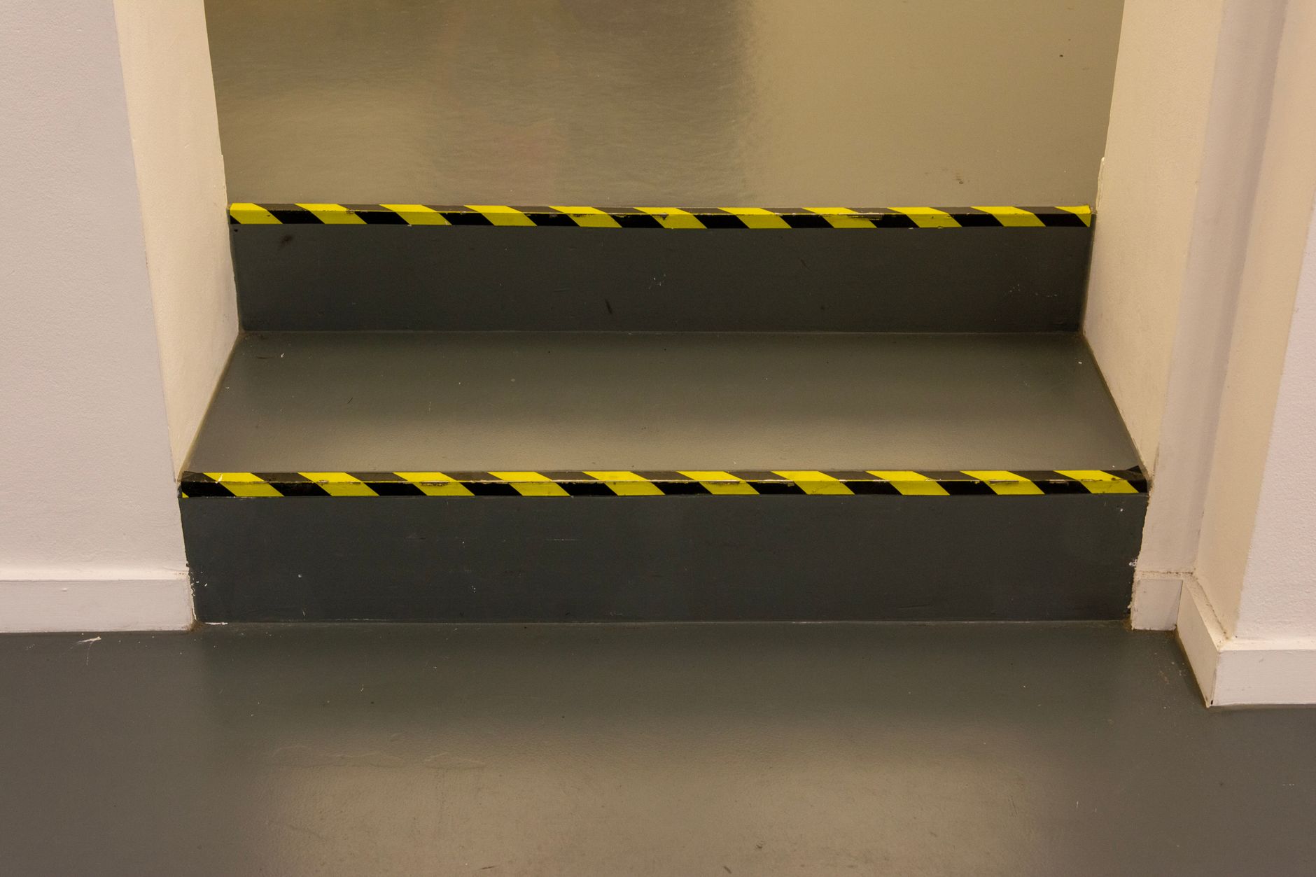 Floor tape and a measured soil patch represent the fixed route and soil load each demo must share.