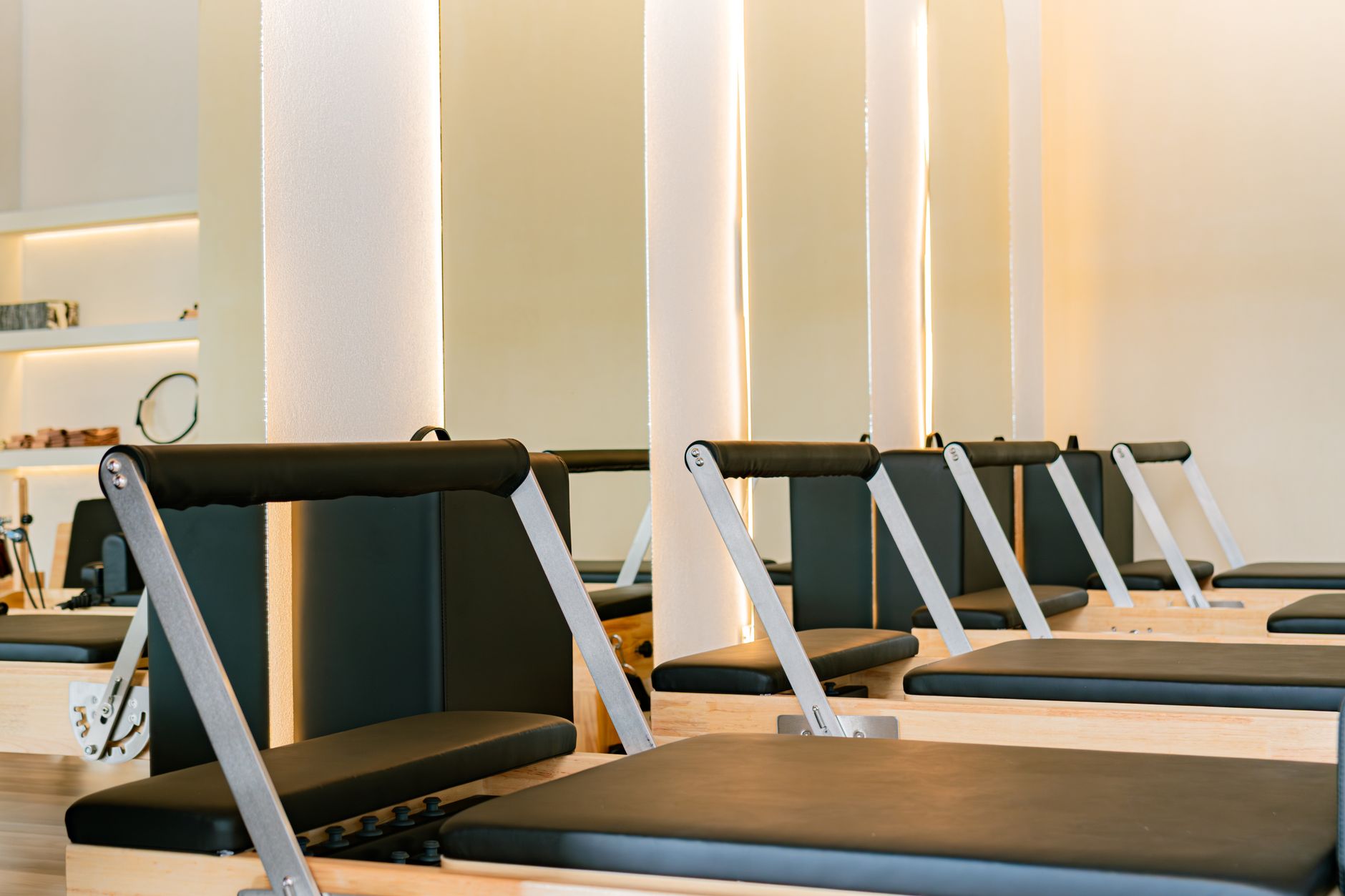 Open rehab gym floor with fixed equipment around the perimeter and clear circulation space for a low-risk pilot route.
