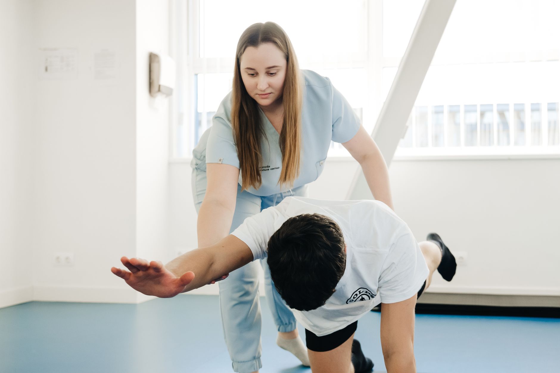 Wide view of an outpatient physical therapy clinic with clear walking paths between the waiting area and treatment floor.