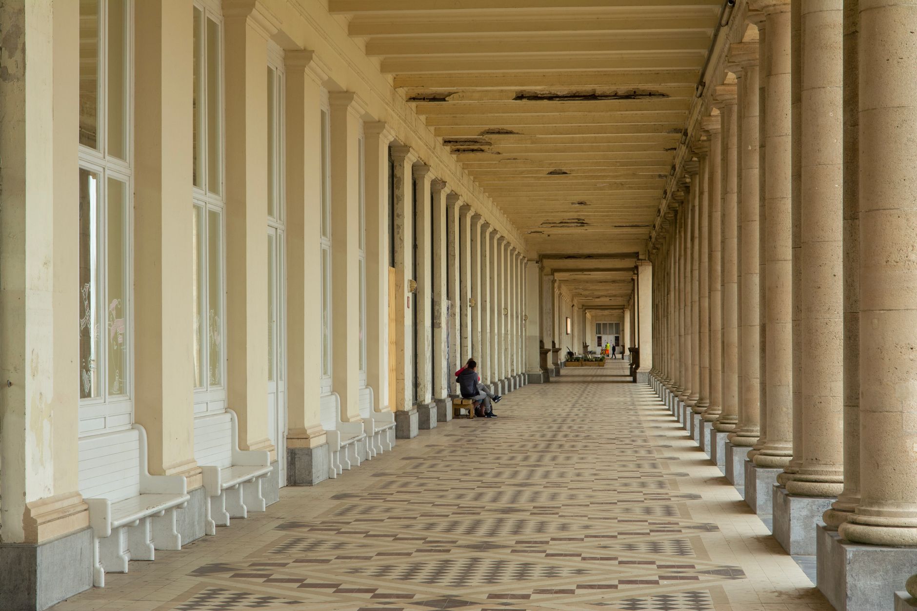 A broad arcade-edge walkway with clear circulation space, illustrating the kind of predictable perimeter zone that belongs in a first mapping pass.