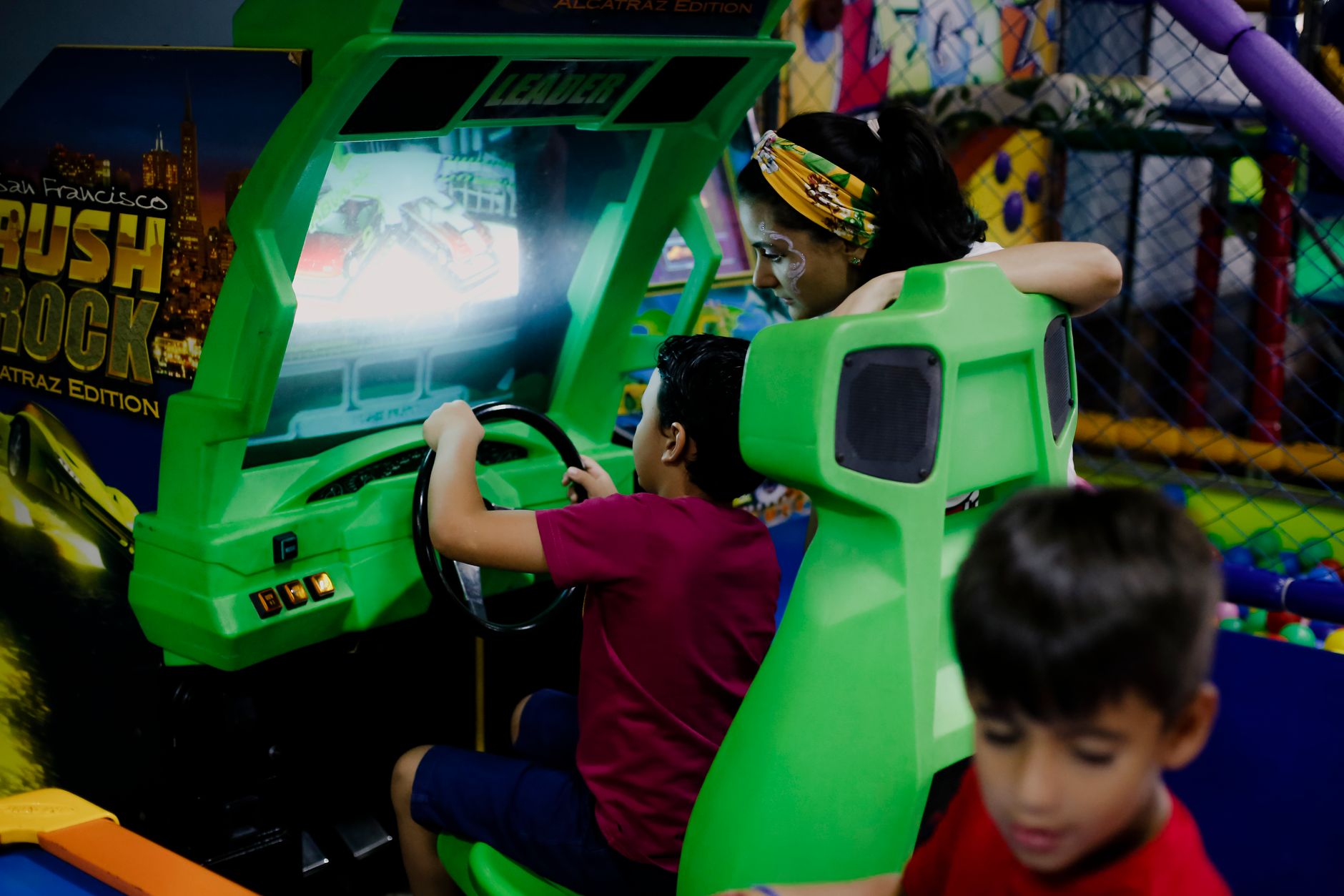 Wide view of a family entertainment venue lobby and circulation lanes, the kind of hard-surface approach area a trampoline park would target in an overnight cleaning pilot.