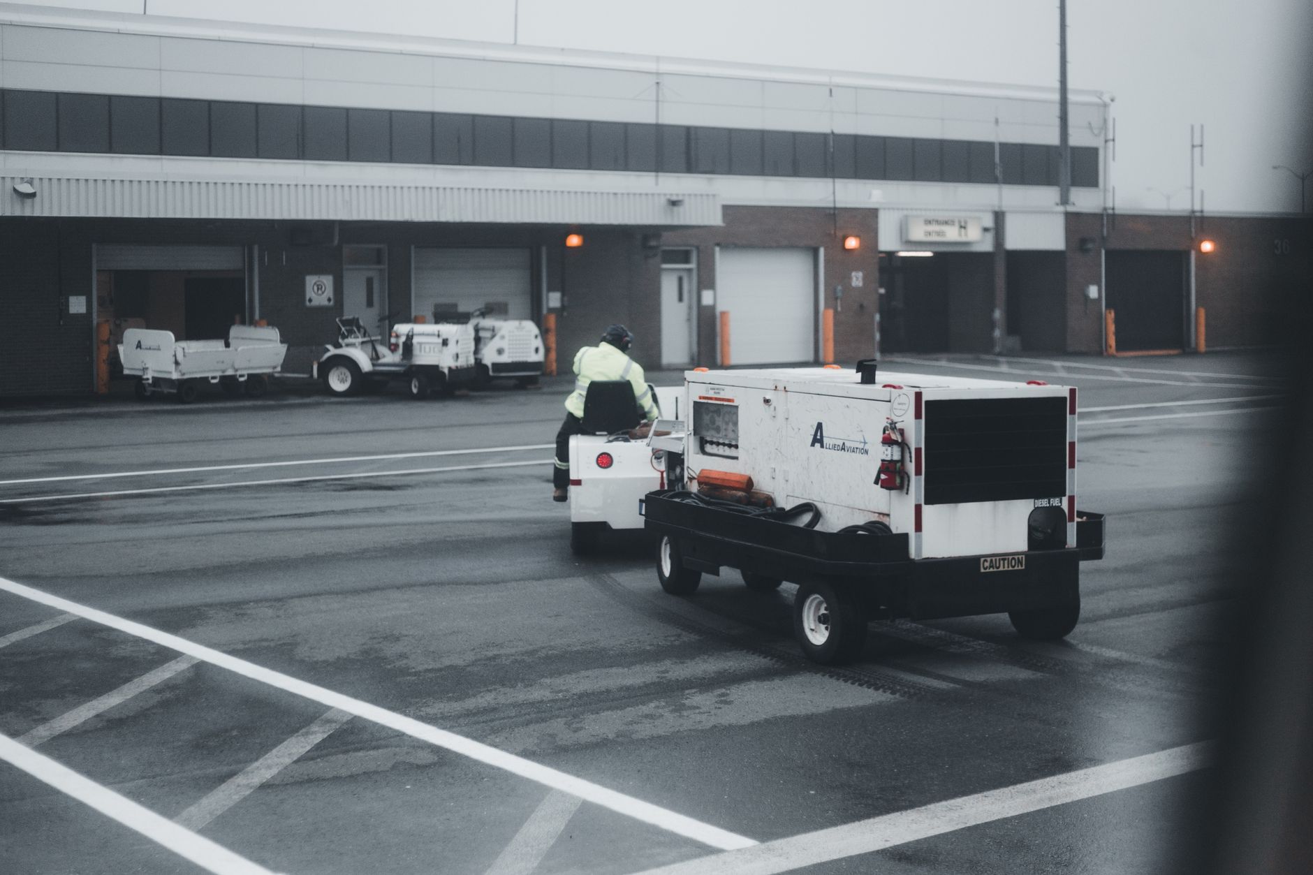 A marked truck inspection lane at a distribution facility where repeatable trailer checks and routing decisions happen.
