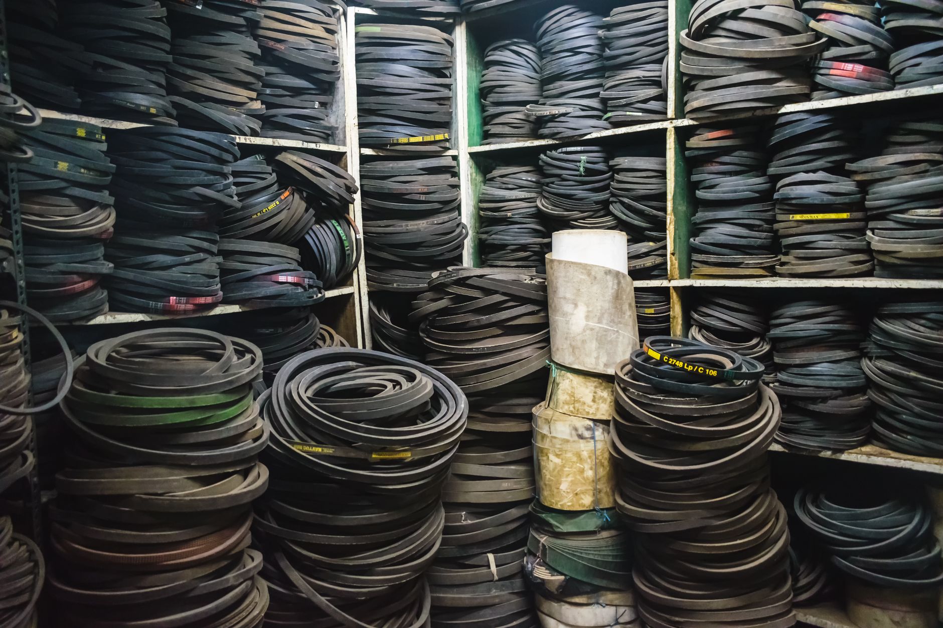 Organized spare parts on warehouse shelving, representing regional stocking for robot wear items.