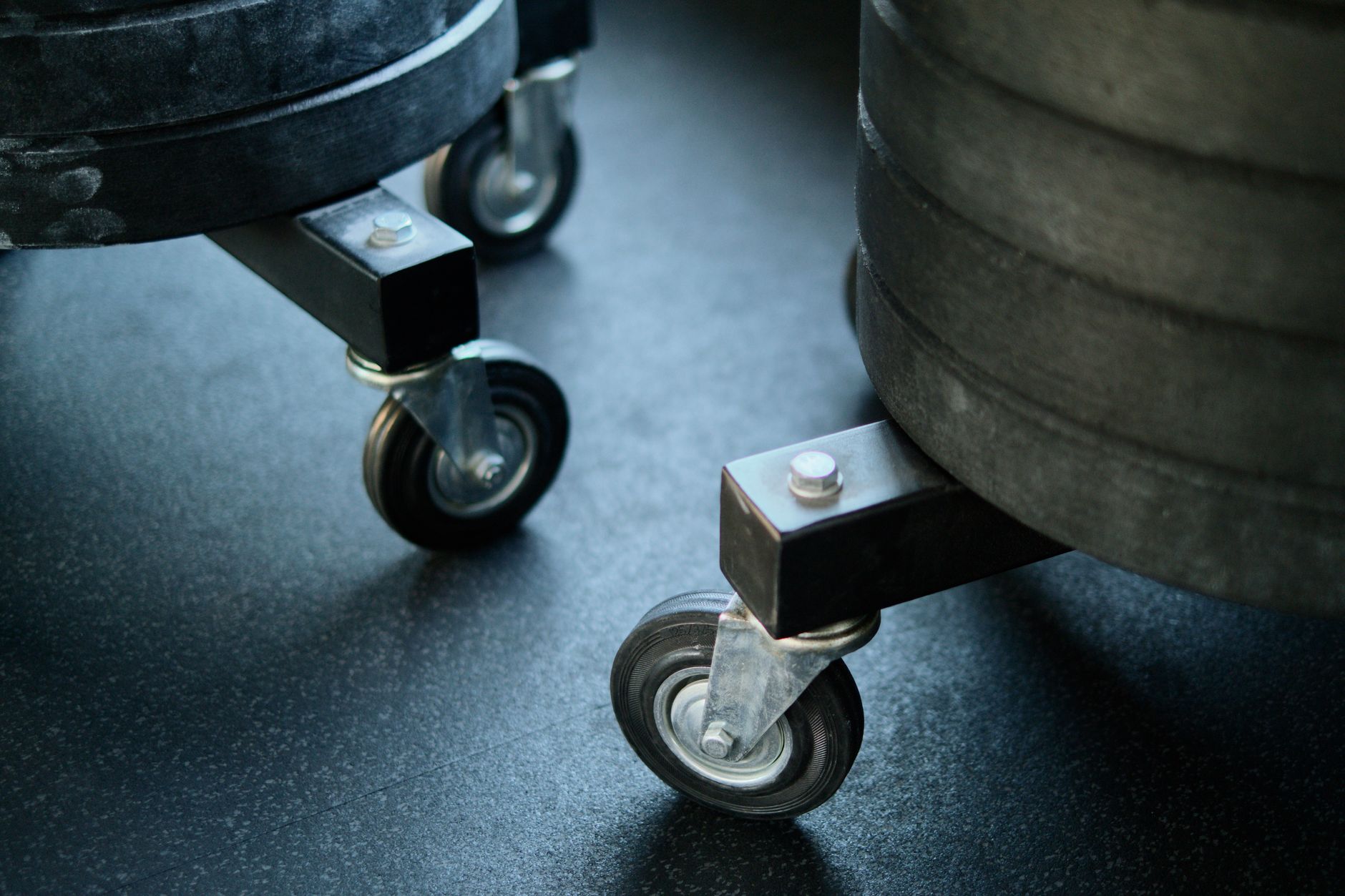 Close view of textured rubber gym flooring showing the high-friction surface that traps grit and residue.