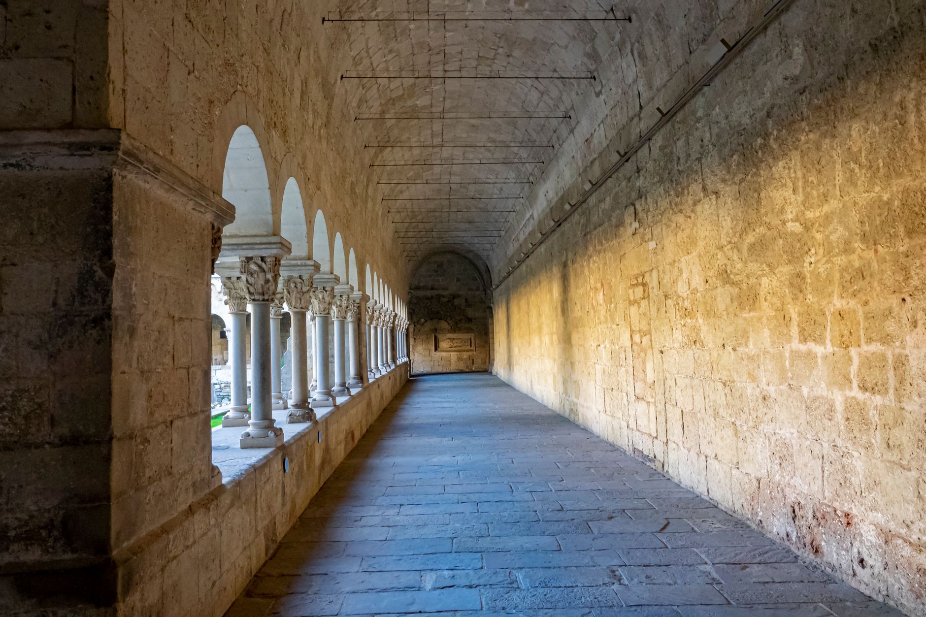 A quiet chapel-side hallway with subdued lighting and clear walking paths, illustrating the need for low-noise overnight cleaning near family-facing spaces.
