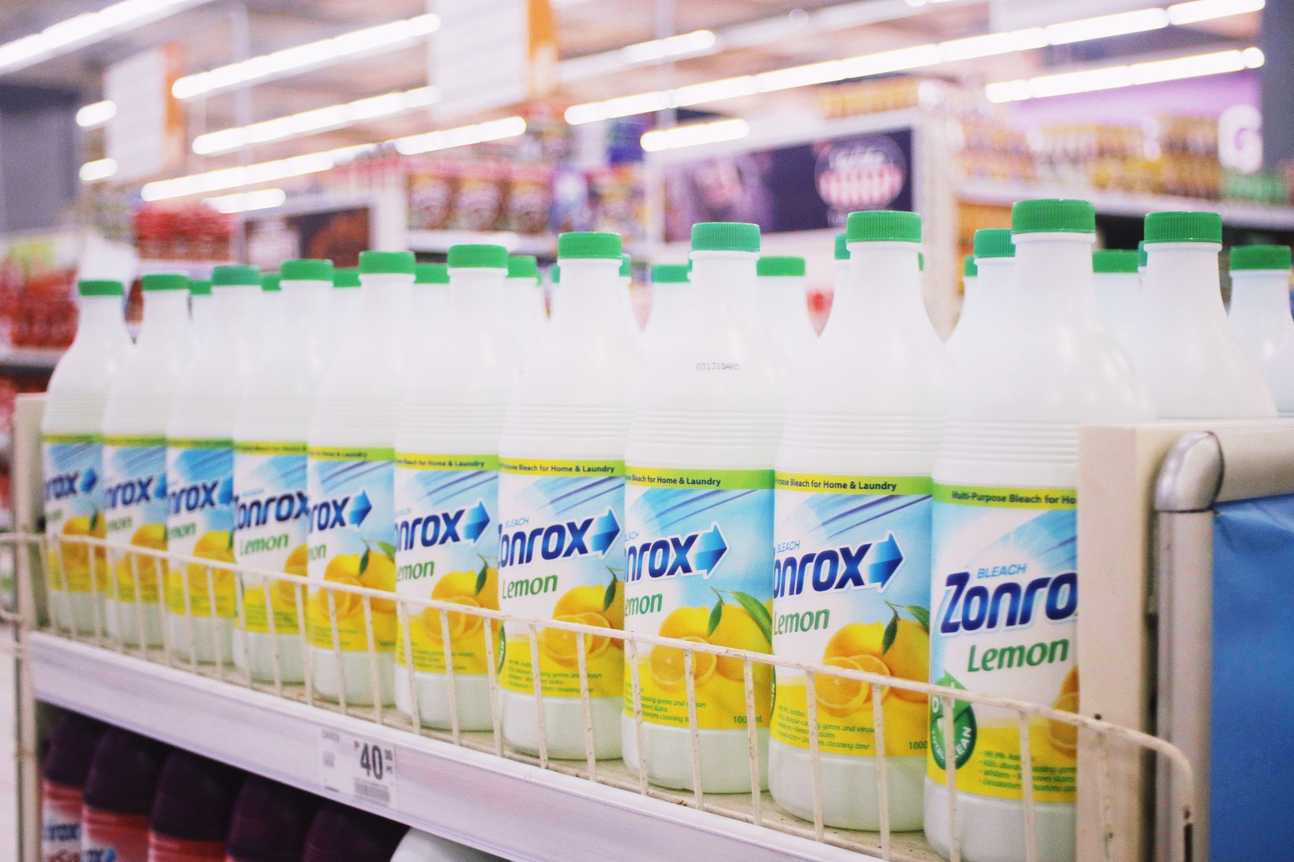 Labeled cleaning products and protective gloves arranged for a chemical documentation review.