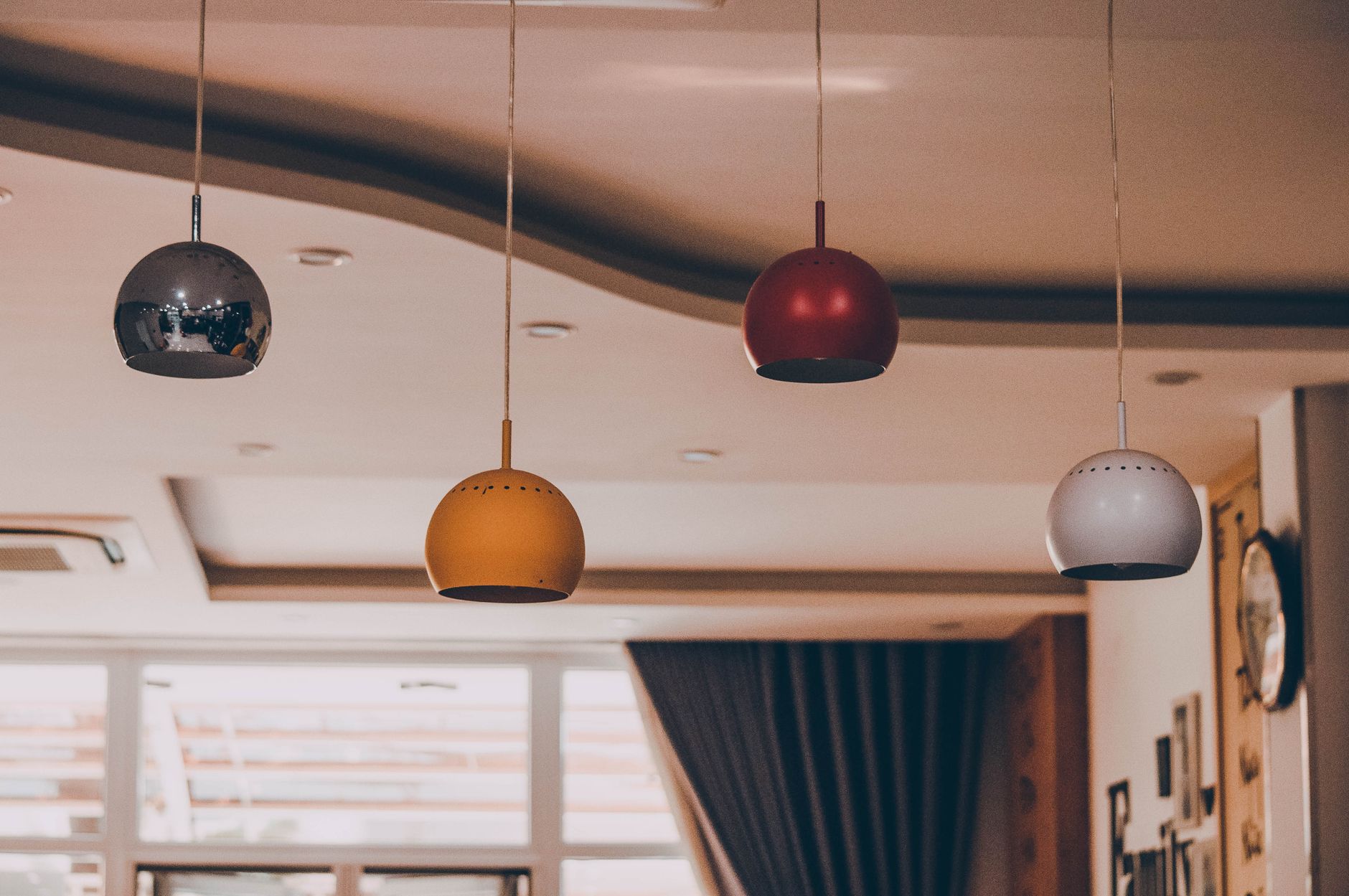 A suspended drop ceiling with removable tiles shows the tight access points and narrow plenum routes that often favor a crawler.
