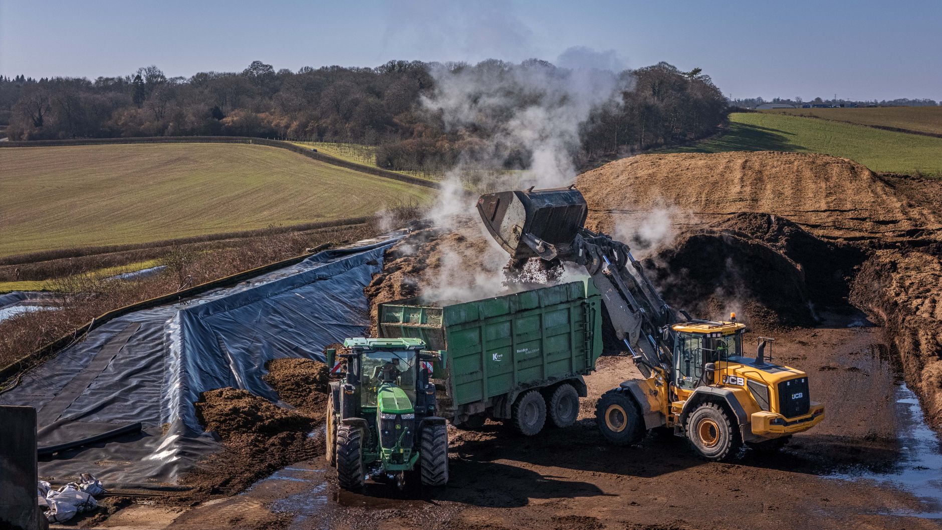 Long compost windrows at a commercial yard where temperature and turning records must be maintained.