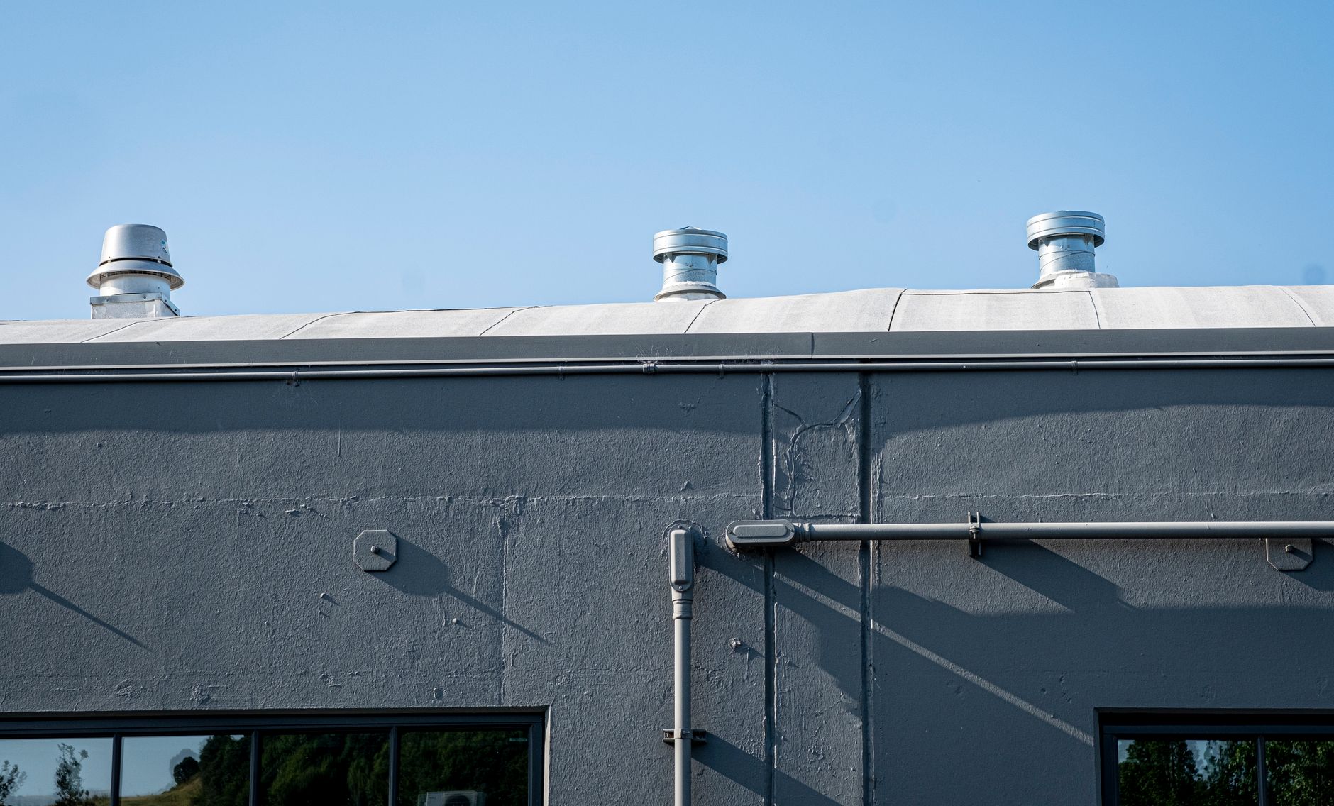 Roof-mounted exhaust termination that should appear in exterior inspection photos.