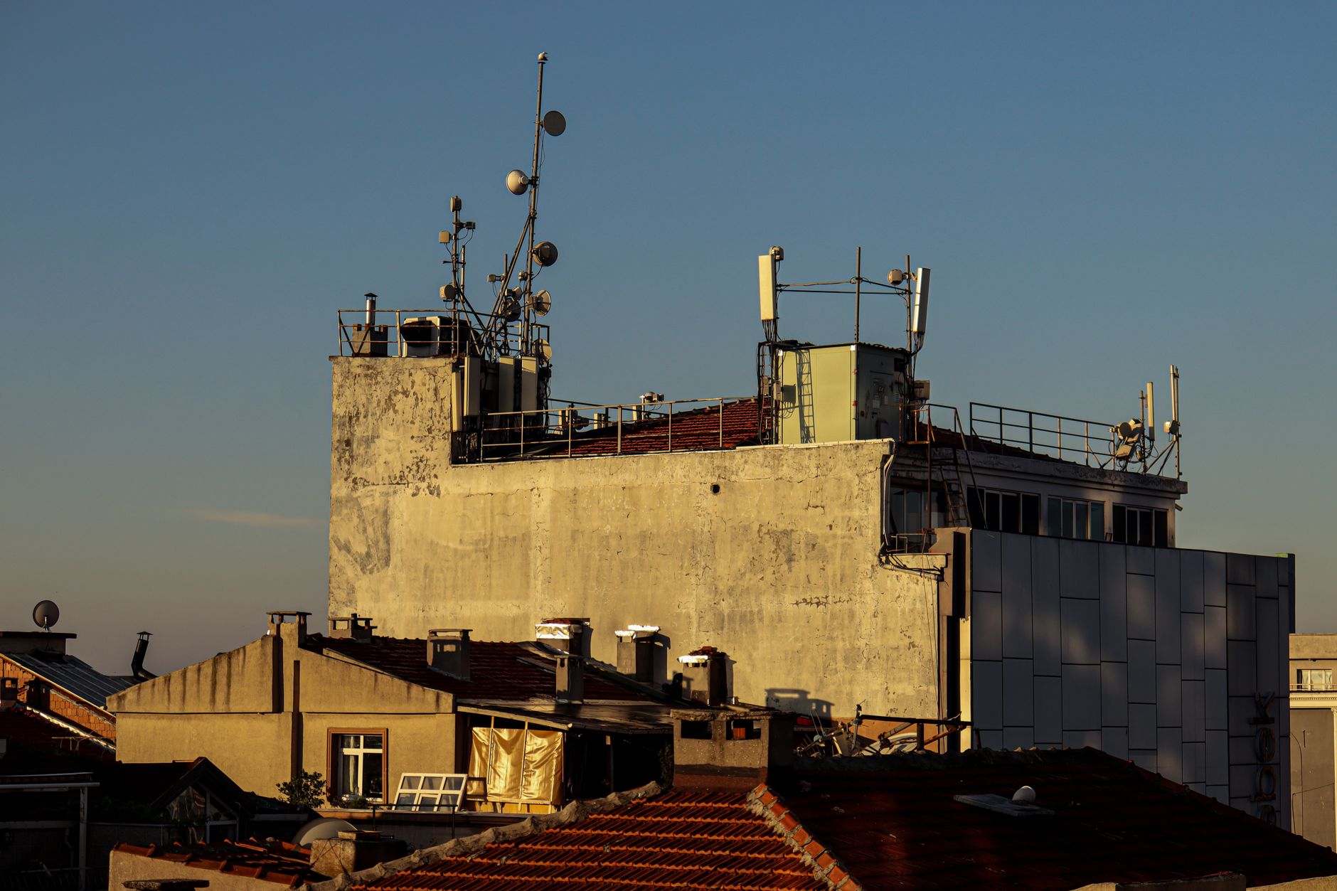 Rooftop cooling towers and adjacent service access at a commercial building, matching the kind of mechanical plant this guide discusses.