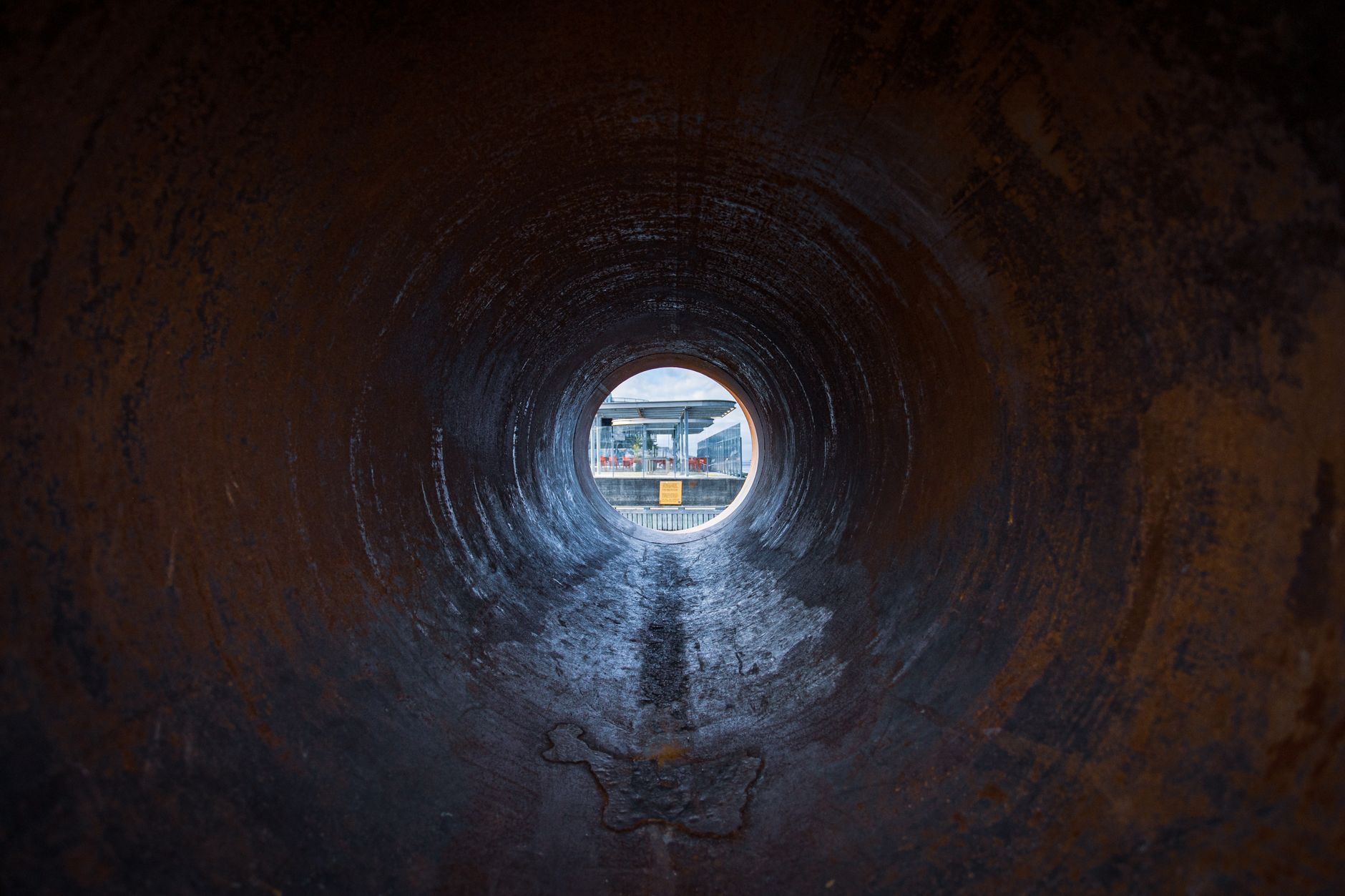 Pipe rack and valves in a utility tunnel where thermal and visual inspection stops target leaks and heat.