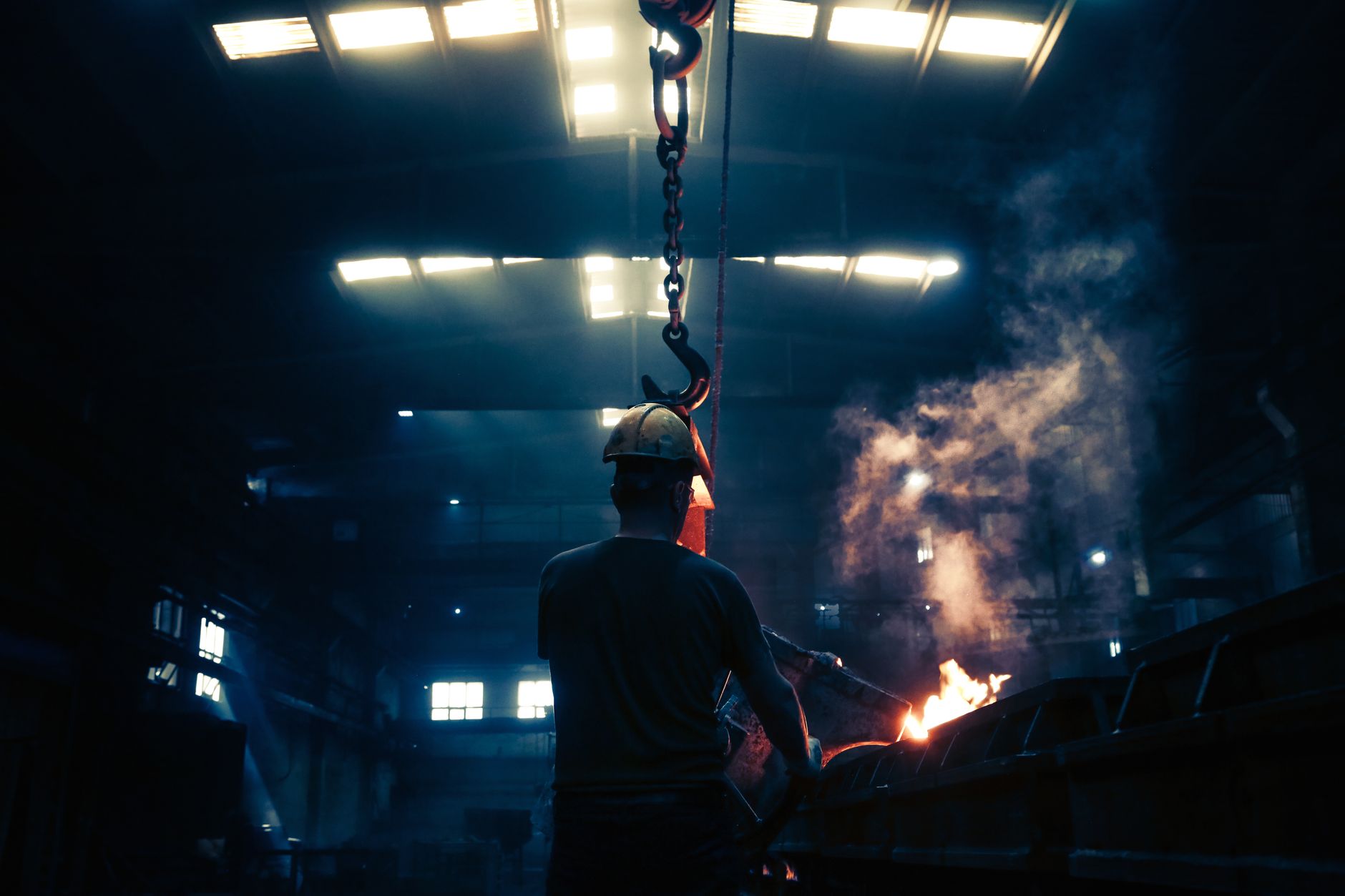 Portable work lighting brought into a dark industrial space before internal dust collector imaging.