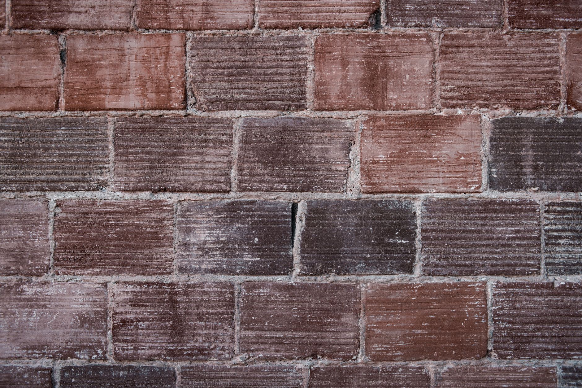 Refractory lining inside a cooled kiln, where slumped brick, deposits, and crack patterns can be documented before repairs disturb them.